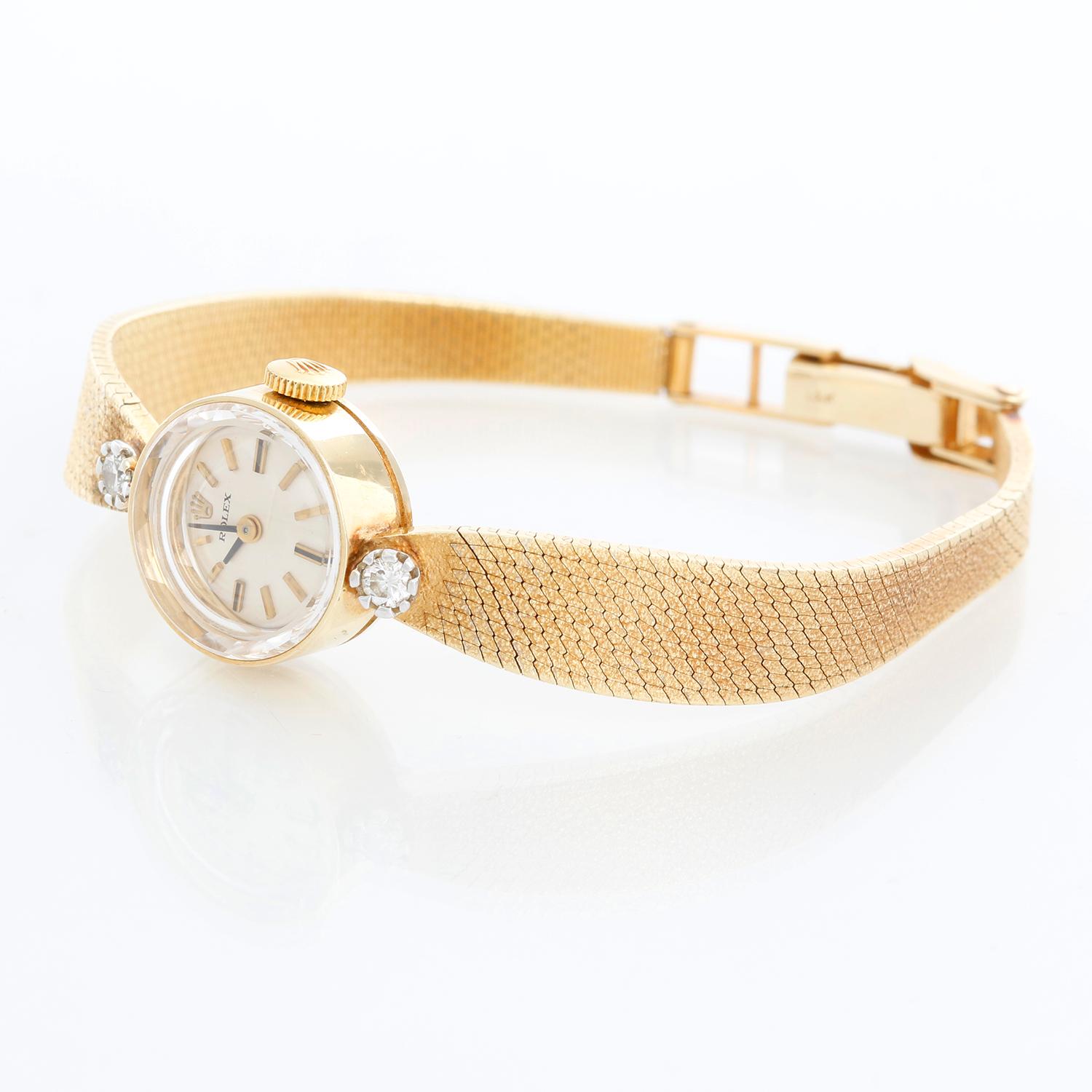 Vintage Rolex Ladies 14k Yellow Gold Watch Ref. 3523 - Manual wind. Gold case (15mm) with diamond lugs. Silver dial with stick markers. 14k gold mesh bracelet with deployant buckle; will fit up to a 5 3/4 inch wrist . Pre-owned with custom box .