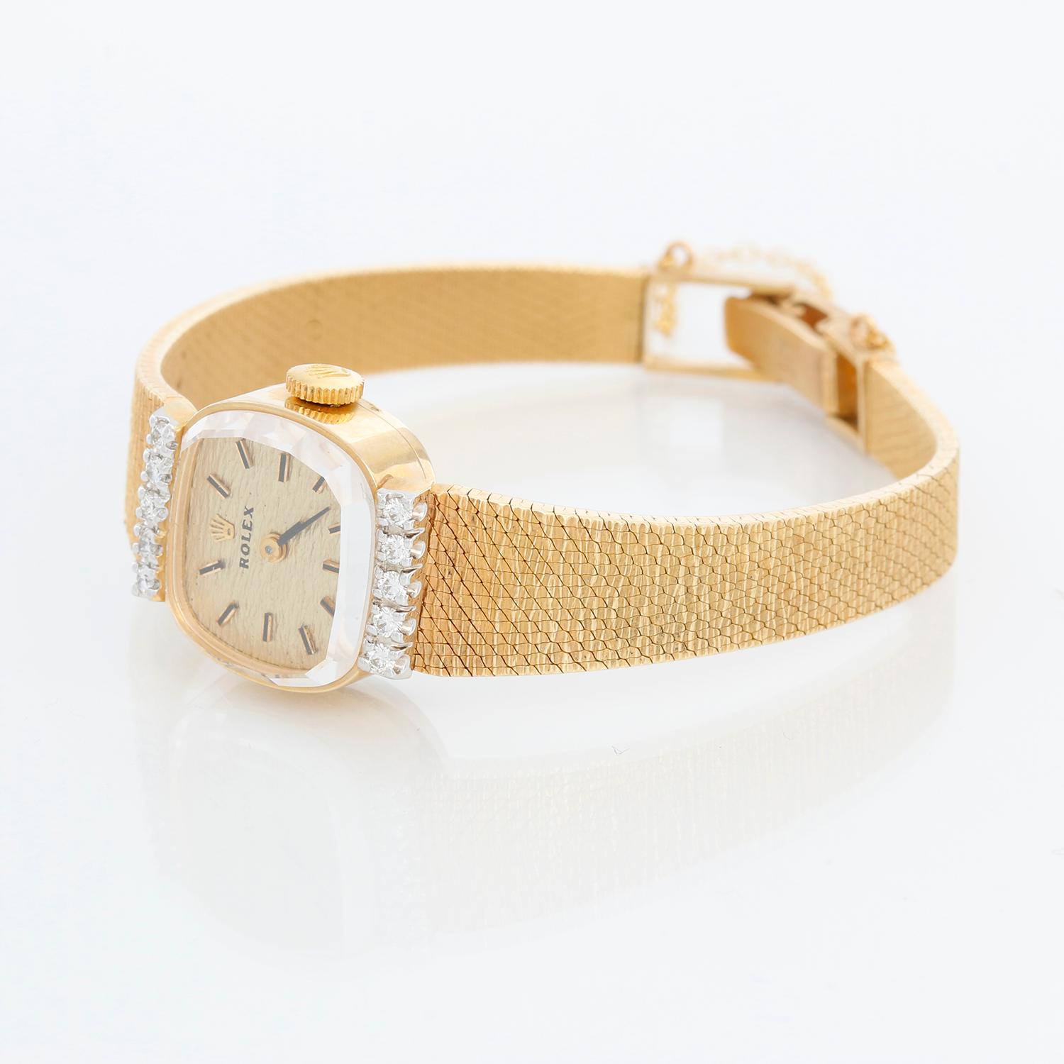 Vintage Rolex Ladies 14K  Yellow Gold Watch Ref 8374 - Self winding. 14K Yellow gold dial with diamond on lugs ( 17 mm). Champagne texture dial with stick hour markers. 14K Yellow gold bracelet; will fit up to a 5 3/4 inch wrist. Pre-owned with