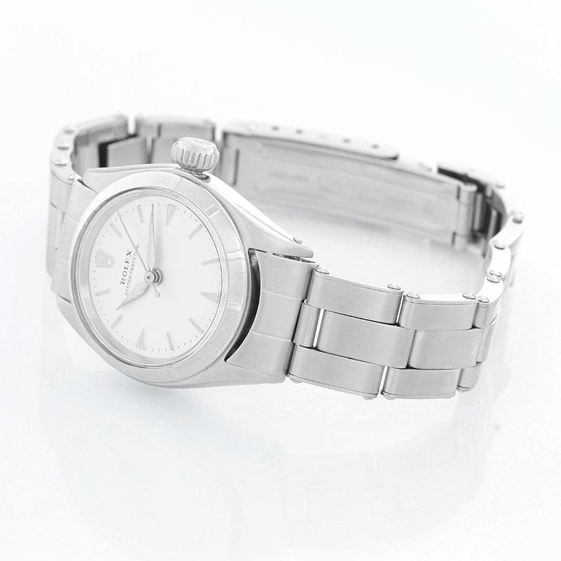 Vintage Rolex Ladies Oyster Perpetual Date Watch 6623 - Self winding. Stainless steel case with engine turn bezel   ( 26 mm). Silver dial. Stainless steel bracelet with steel buckle. Pre-owned with custom box. Circa 1950's -1960's.