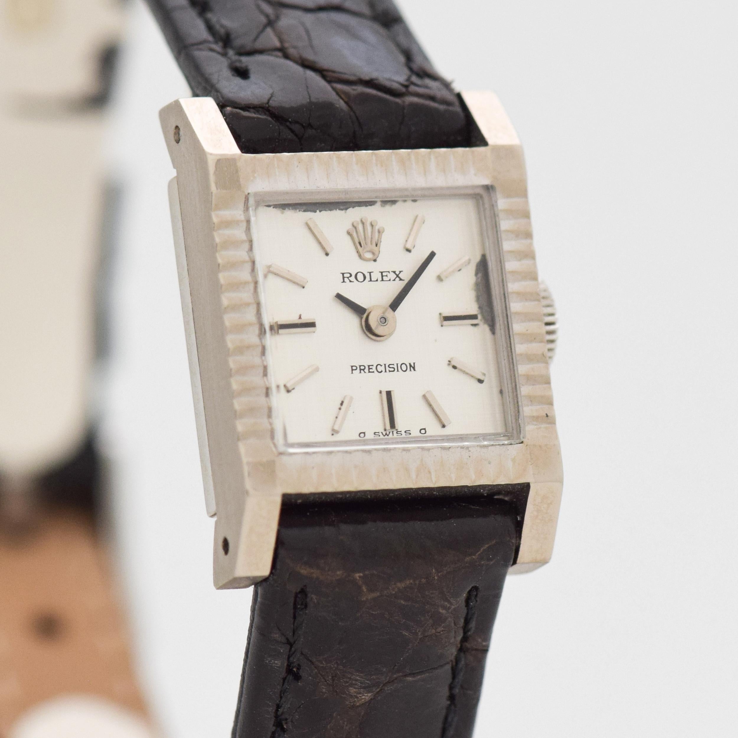 1973 Vintage Rolex Ladies Ref. 2602 2 18k White Gold watch with Original Silver Dial with Applied Steel Stick/Bar/Baton Markers with Rolex Steel Buckle. Case size, 16mm x 23mm lug to lug (0.63 in. x 0.91 in.) - Powered by an 18-jewel, manual caliber