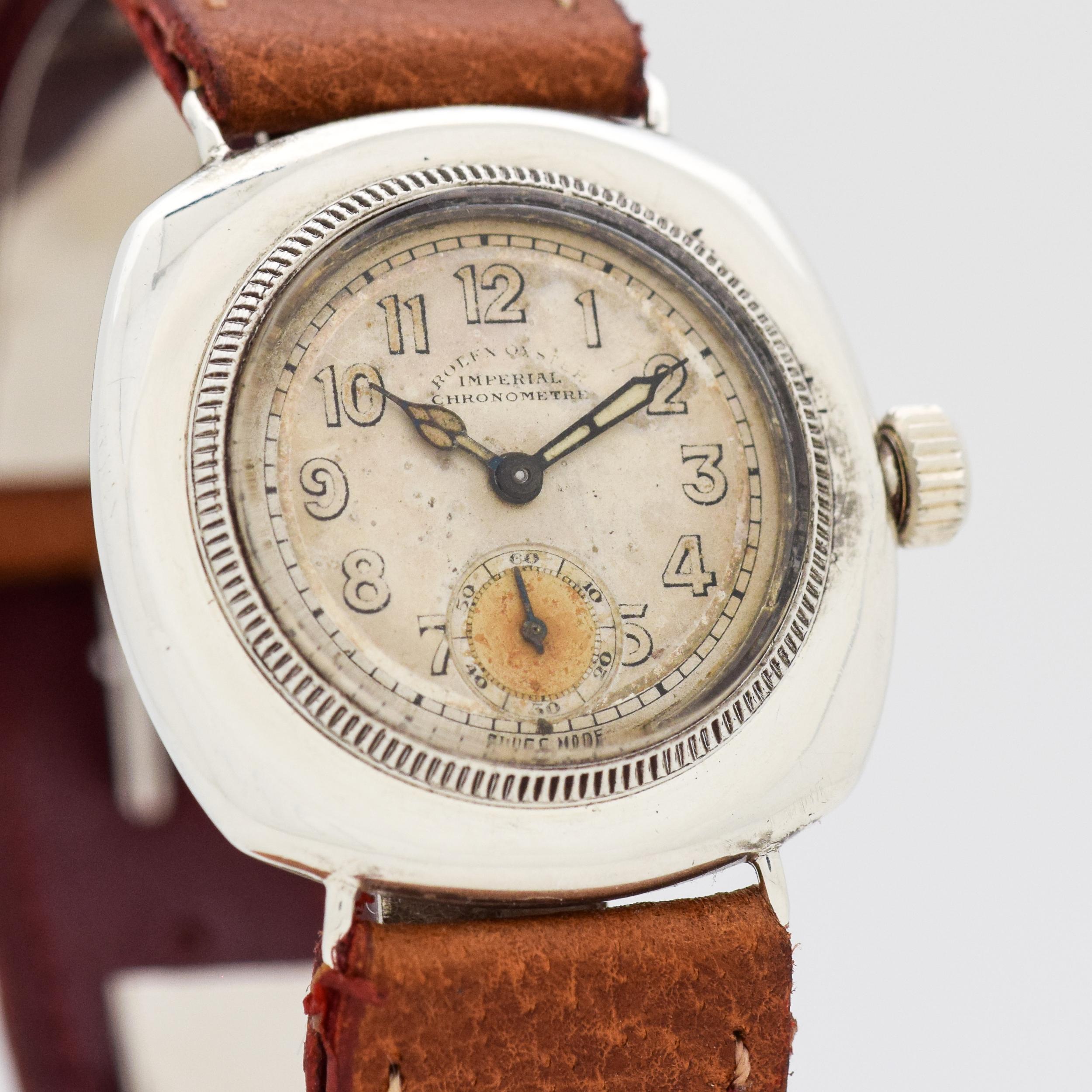 1925 Vintage Rolex Very Early Oyster Imperial Chronometre Cushion Shape Nickle watch with Original Silver Dial with Evaporated Luminous Arabic Numbers. 32mm x 38mm lug to lug (1.26 in. x 1.5 in.) - 15 jewel, manual caliber movement. Vintage-style