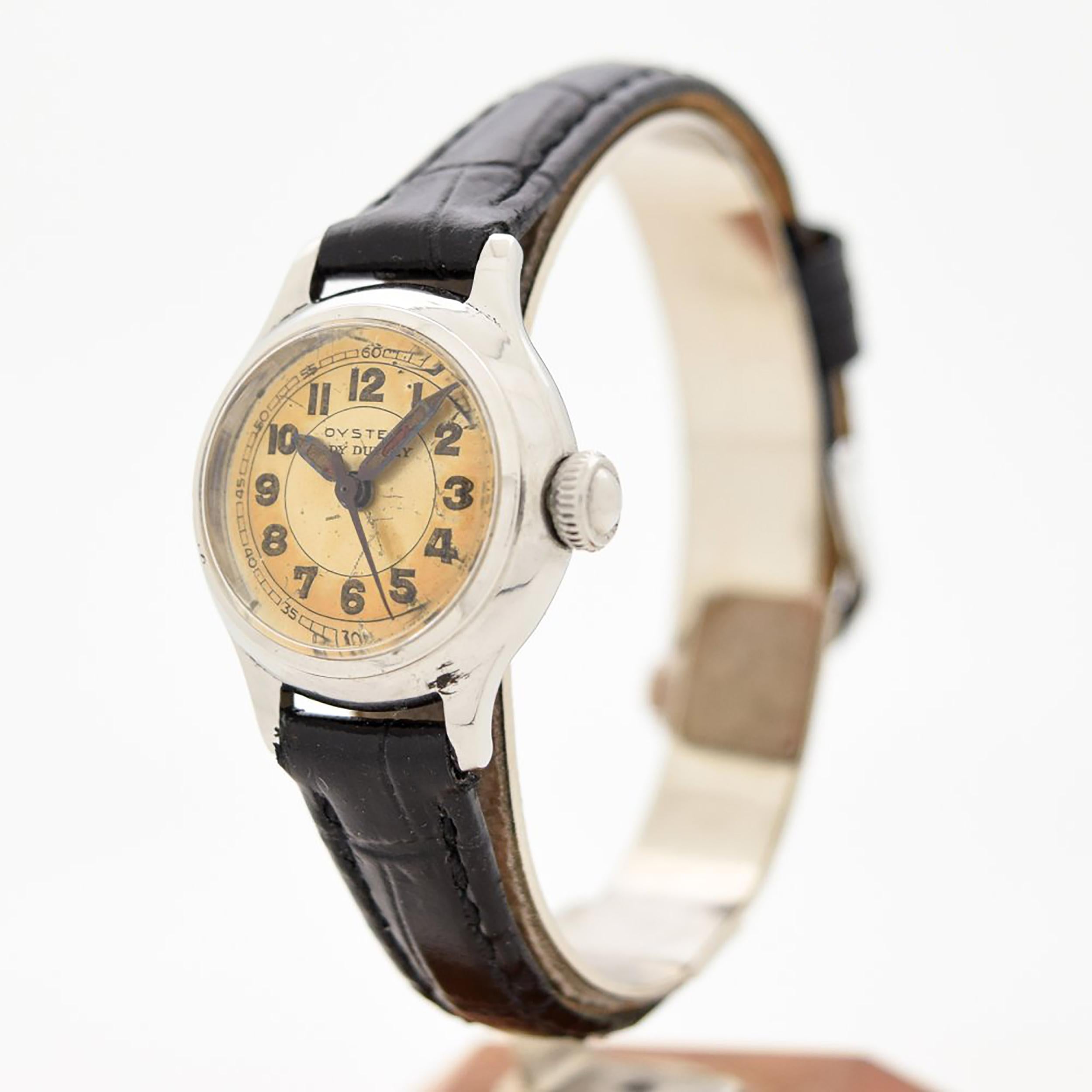 1952 Vintage Oyster by Rolex Ladies Lady Dudley Ref. 3640 Stainless Steel watch with Original Patina Two Tone Gray and Silver Dial with Luminous Arabic Numbers. 22mm x 27mm lug to lug (0.87 in. x 1.06 in.) - Powered by a 17-jewel, manual caliber