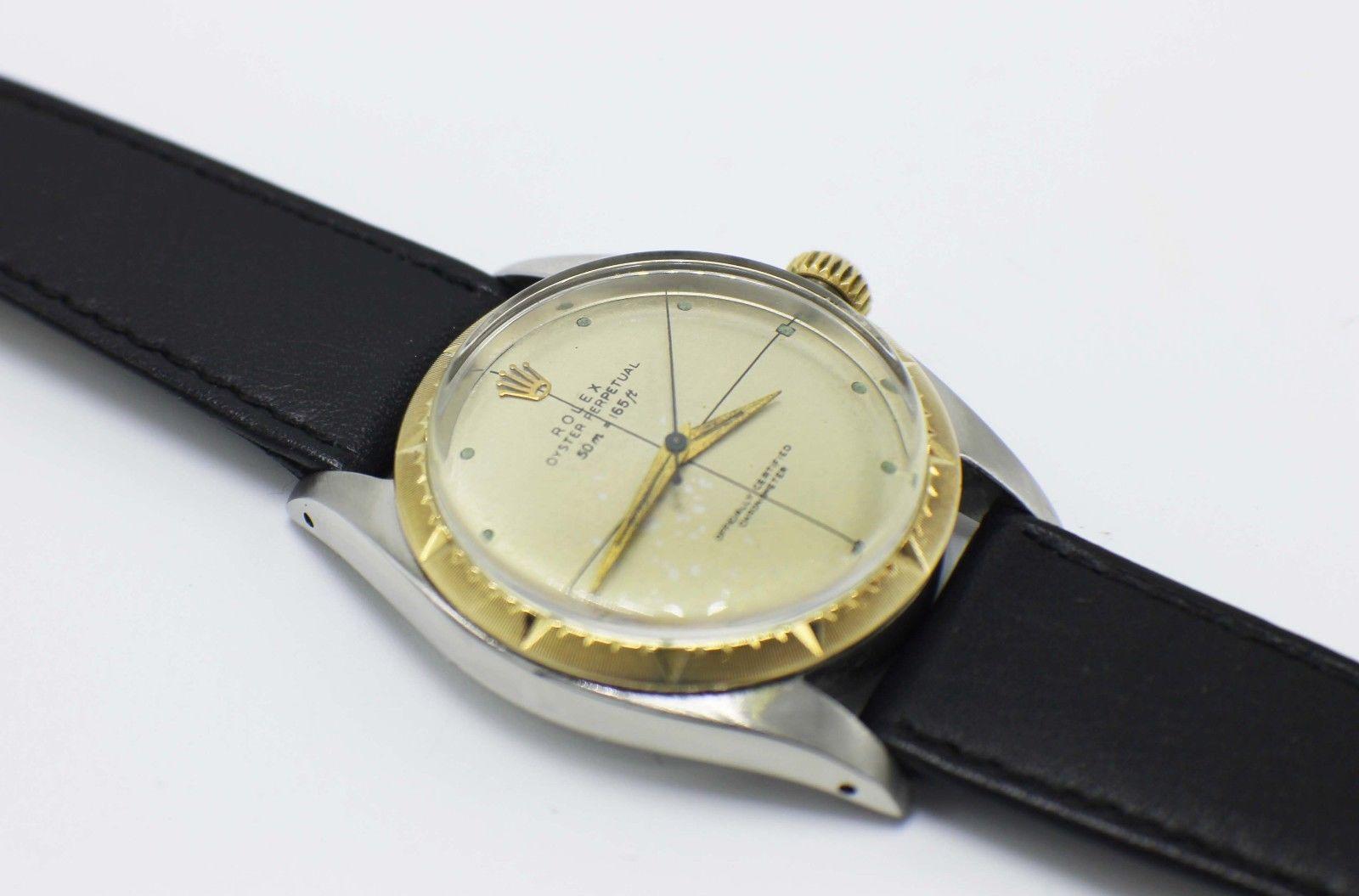 Style Number: 6582

Serial: 135***

Year: Circa 1939

Model: Oyster Perpetual

Case Material: Stainless Steel

Band: Leather

Bezel: 14K Yellow Gold

Dial: Champagne 

Face: Acrlyic

Case Size: 34mm

Includes: 

-Elegant Watch Box

-Certified
