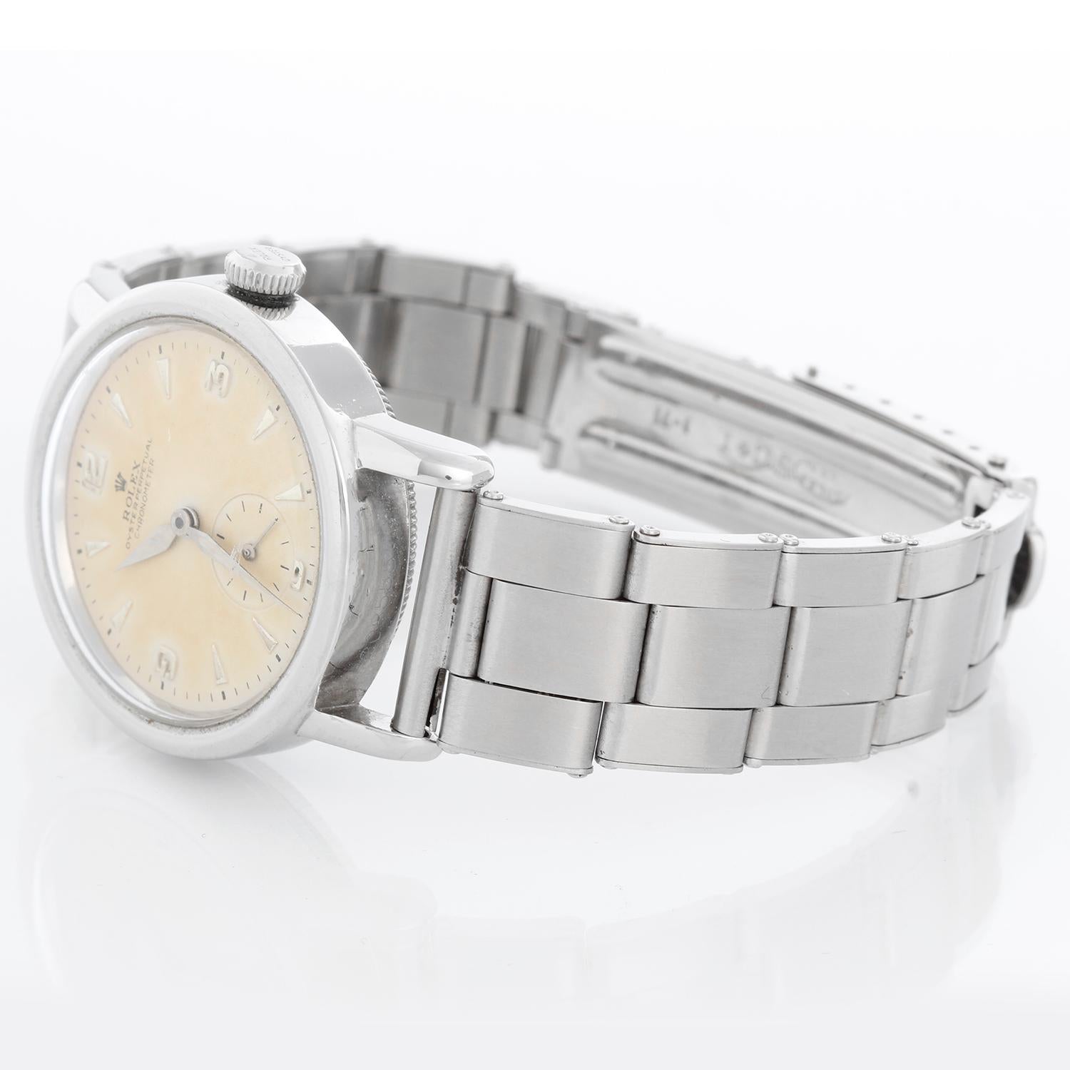 Vintage Rolex Oyster Perpetual Bubble Back Men's Ref. 3716 - Automatic winding. Polished stainless steel case (32 mm). White Arabic and raised numeral hour markers ; subseconds and chrome hands. Stainless steel bracelet. Pre-owned with custom box.