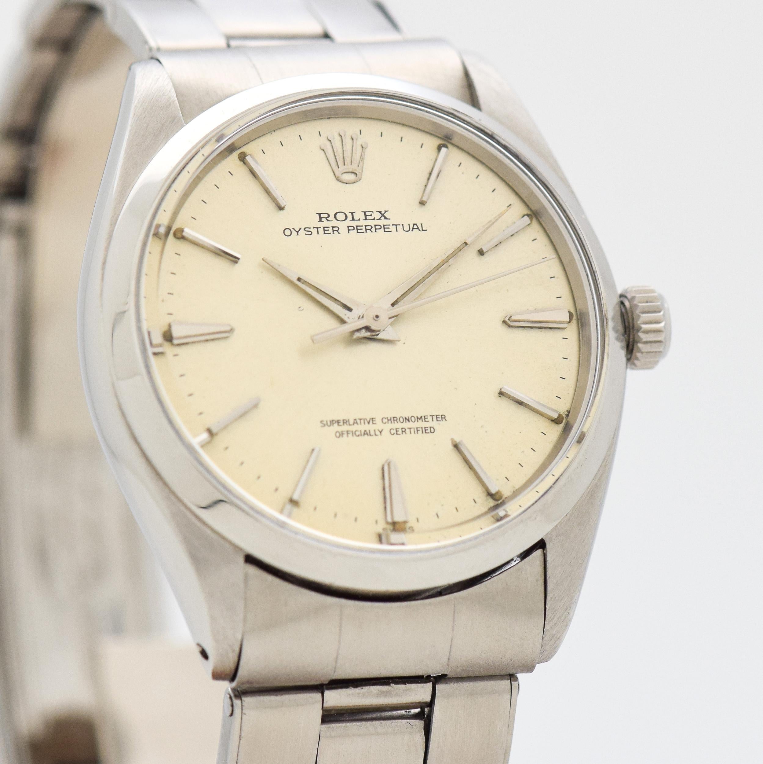 1963 Vintage Rolex Oyster Perpetual Ref. 1002 Stainless Steel watch with Original Silver Dial with Attached Steel Beveled Stick/Bar/Baton Markers with Original Rolex Stainless Steel Oyster Bracelet. 34mm x 38mm lug to lug (1.34 in. x 1.5 in.) - 26