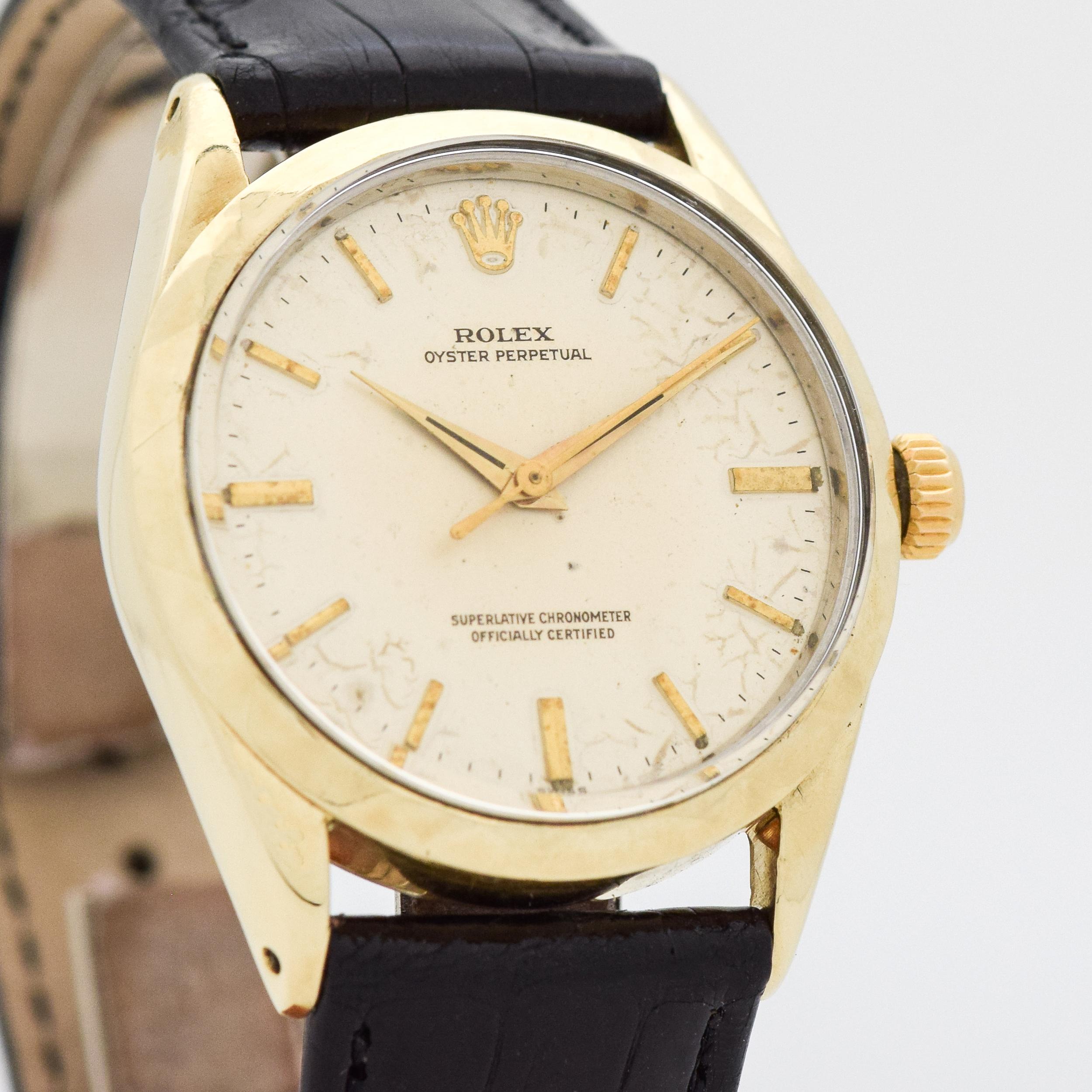Early 1960's Vintage Rolex Oyster Perpetual Ref. 1025 14k Yellow Gold Shell Over Stainless Steel watch with Rare Unique Triangle Beveled Pattern Bezel with Original Silver Dial with Applied Gold Color Beveled Elongated Arrow Markers. 34mm x 39mm lug