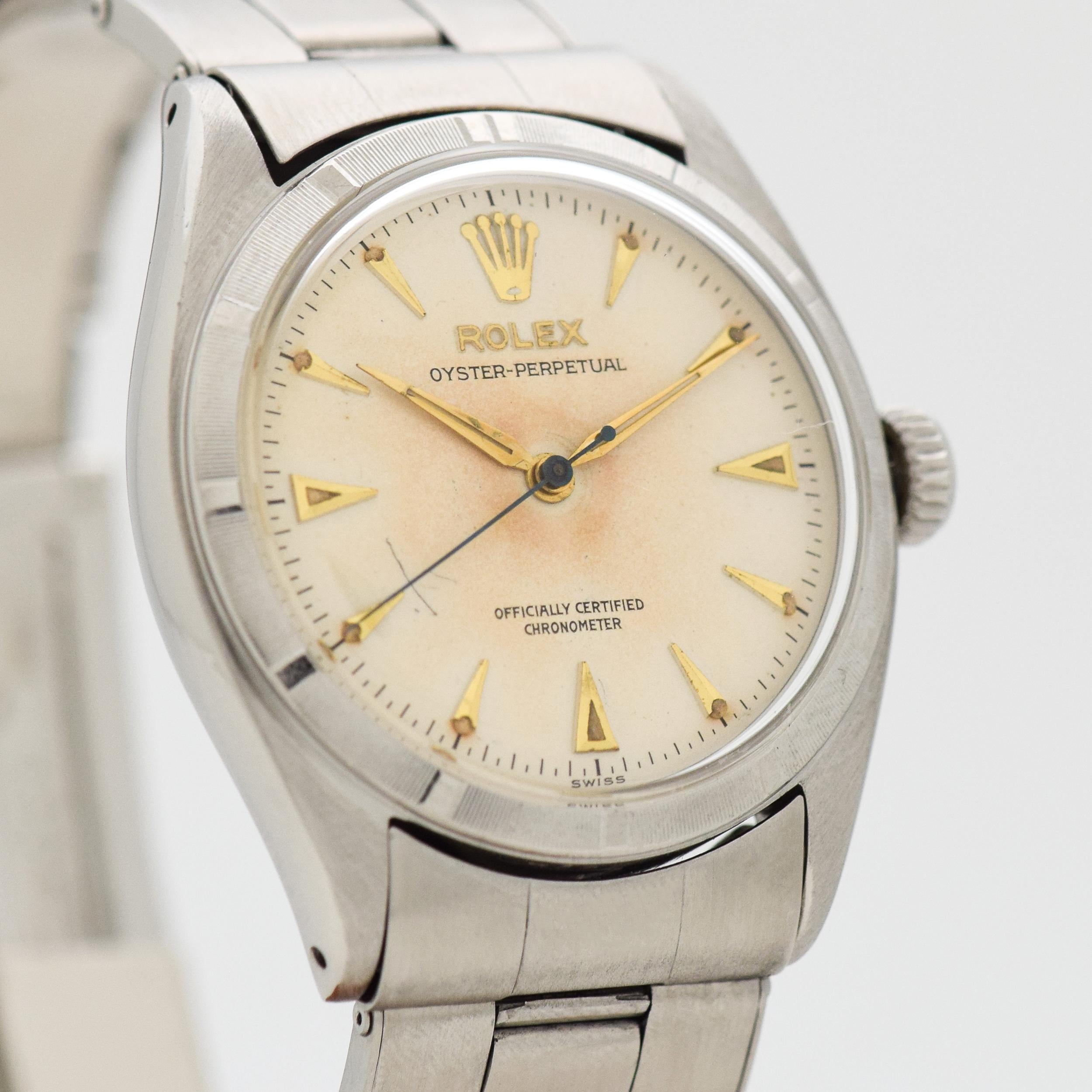 1957 Vintage Rolex Oyster Perpetual Ref. 6085 Edelstahl-Uhr mit bearbeiteter Lünette mit Original-Silber-Zifferblatt mit applizierten Gold abgeschrägten länglichen Pfeil-Markierungen mit Original-Edelstahl 