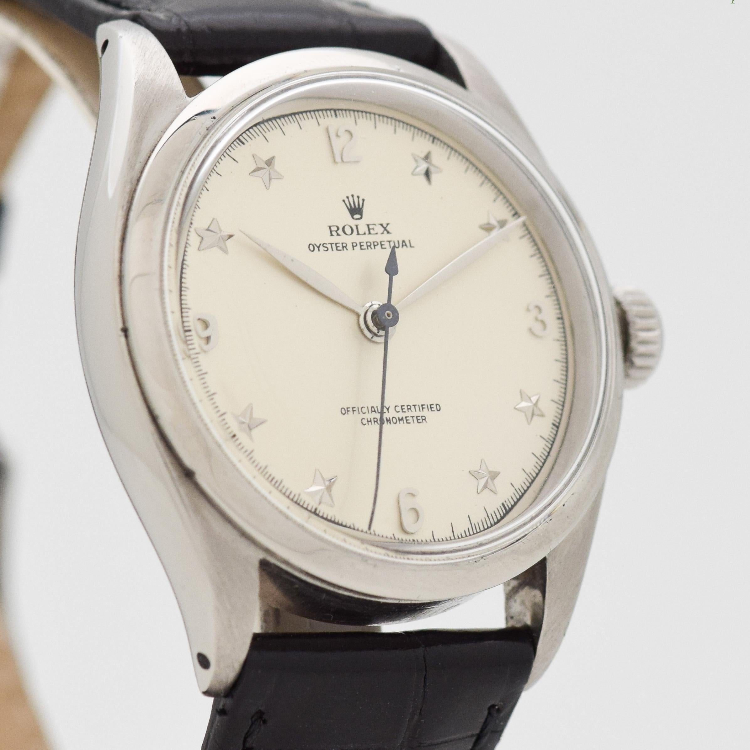 1953 Vintage Rolex Oyster Perpetual Semi-Bubbleback Ref. 6284 Stainless Steel watch with Silver Star Dial with Applied Steel Arabic 3, 6, 9, and 12 with Star Markers. 34mm x 39mm lug to lug (1.34 in. x 1.54 in.) - 18 jewel, automatic caliber
