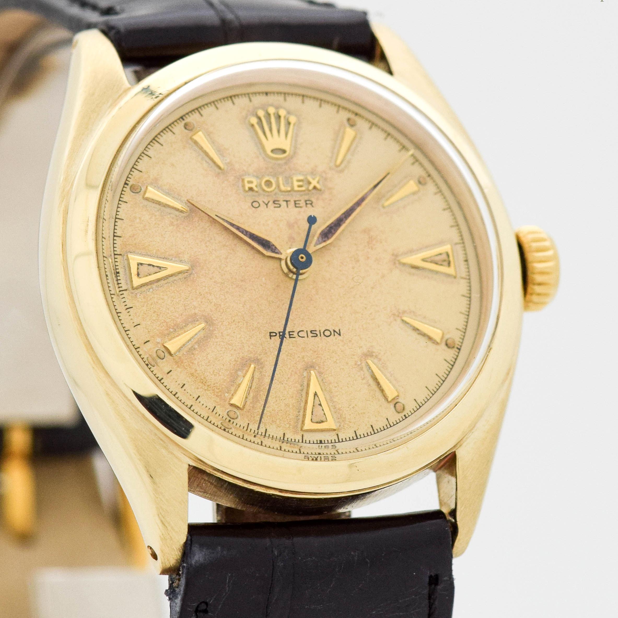 1951 Vintage Rolex Oyster Precision Ref. 6022 10k Yellow Gold watch with Original Silver Dial with Applied Gold Color Elongated Arrow Markers. 34mm x 38mm lug to lug (1.34 in. x 1.5 in.) - 17 jewel, manual caliber movement. Triple Signed.