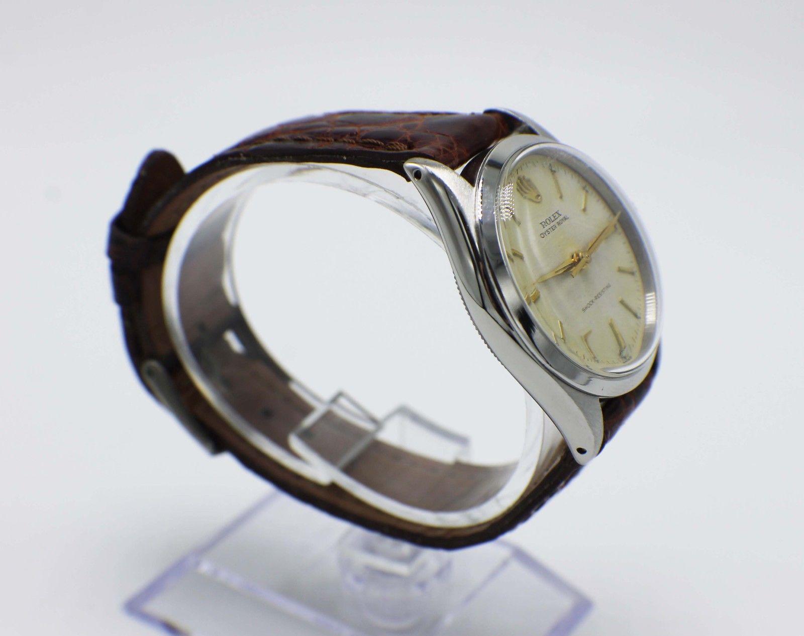 Style Number: 6444

Serial: 205***

Model: Oyster Royal

Case Material: Stainless Steel

Band: Custom Leather Band 

Bezel: Stainless Steel 

Dial: Ivory 

Face: Acrylic

Case Size: 31mm

Includes: 

-Elegant Watch Box

-Certified Appraisal 

-6