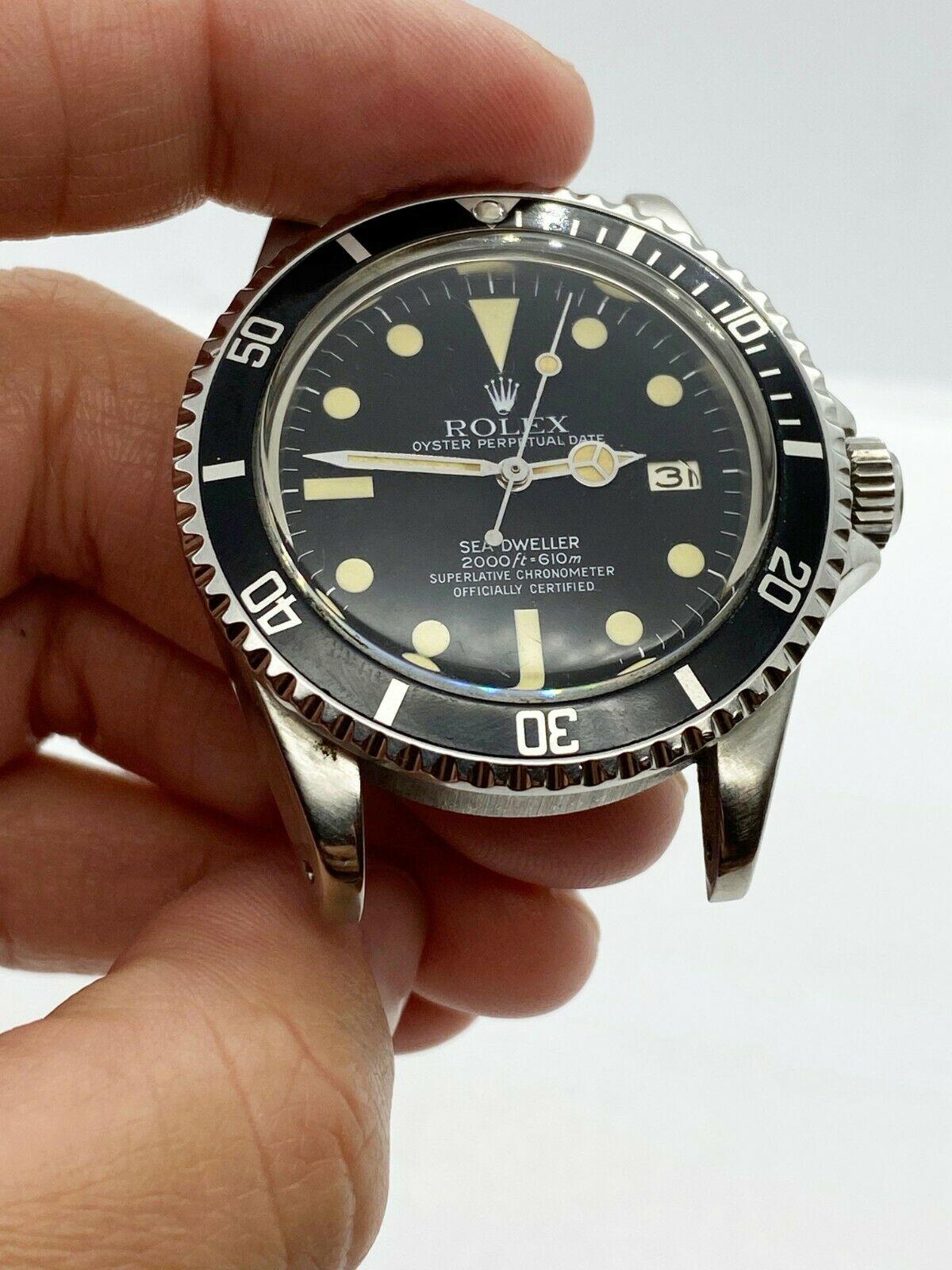 Style Number: 1665

Serial: 6752***

Year: 1981

Model: Sea Dweller

Case Material: Stainless Steel

Band: Stainless Steel

Bezel:  Stainless Steel

Dial: Black

Face: Acrylic

Case Size: 40mm

Includes: 
-Elegant Watch Box
-Certified Appraisal 
-1