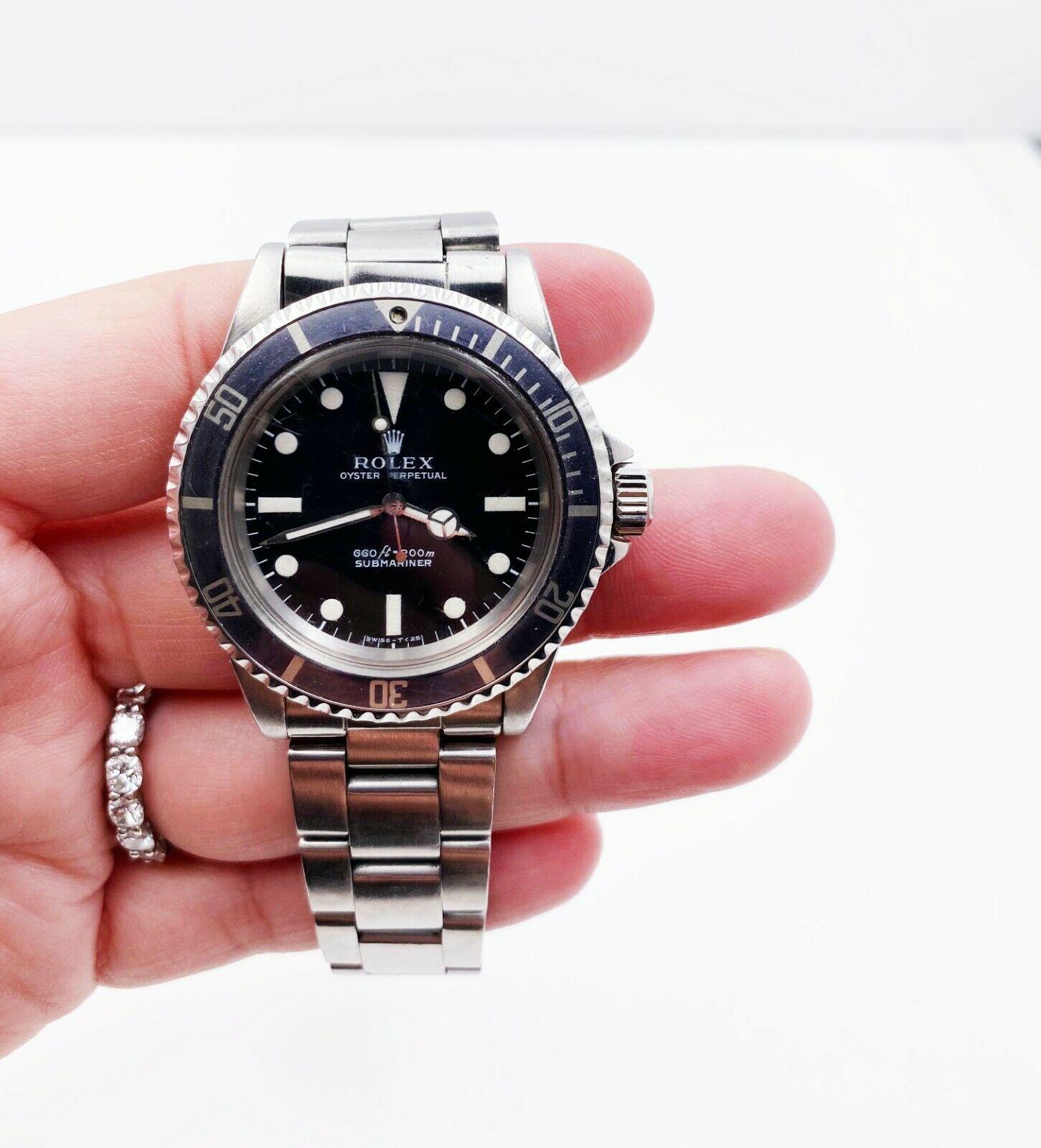Style Number: 5513

 

Serial: 2597***



Year: 1969

 

Model: Submariner

 

Case Material: Stainless Steel

 

Band: Stainless Steel

 

Bezel:  Black

 

Dial: Black

 

Face: Acrylic 

 

Case Size: 40mm

 

Includes: 

-Rolex Service Pouch &