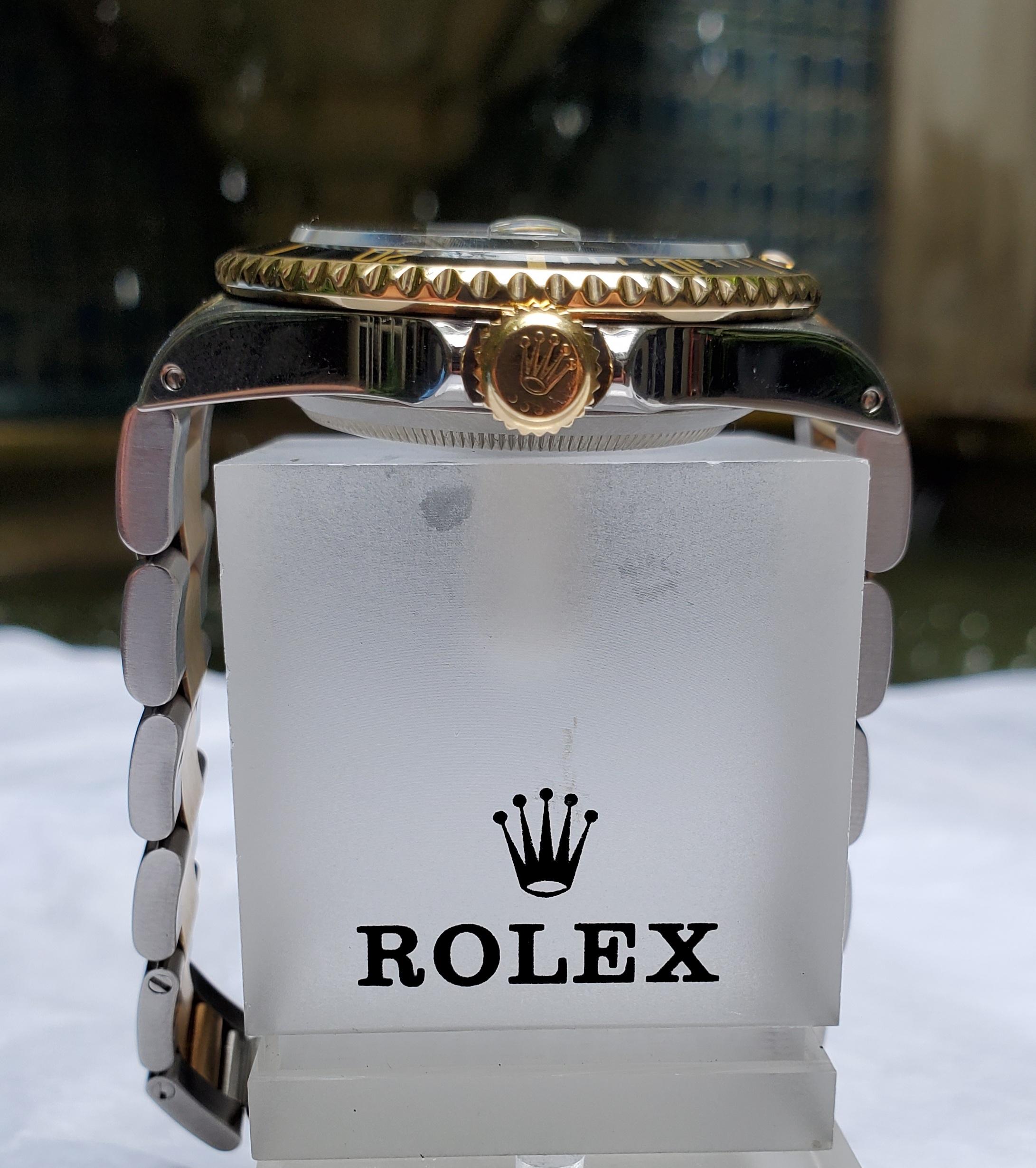 Vintage Rolex Submariner Stainless Steel and 18 Karat Gold, Black Dial/Bezel In Excellent Condition In New Orleans, LA