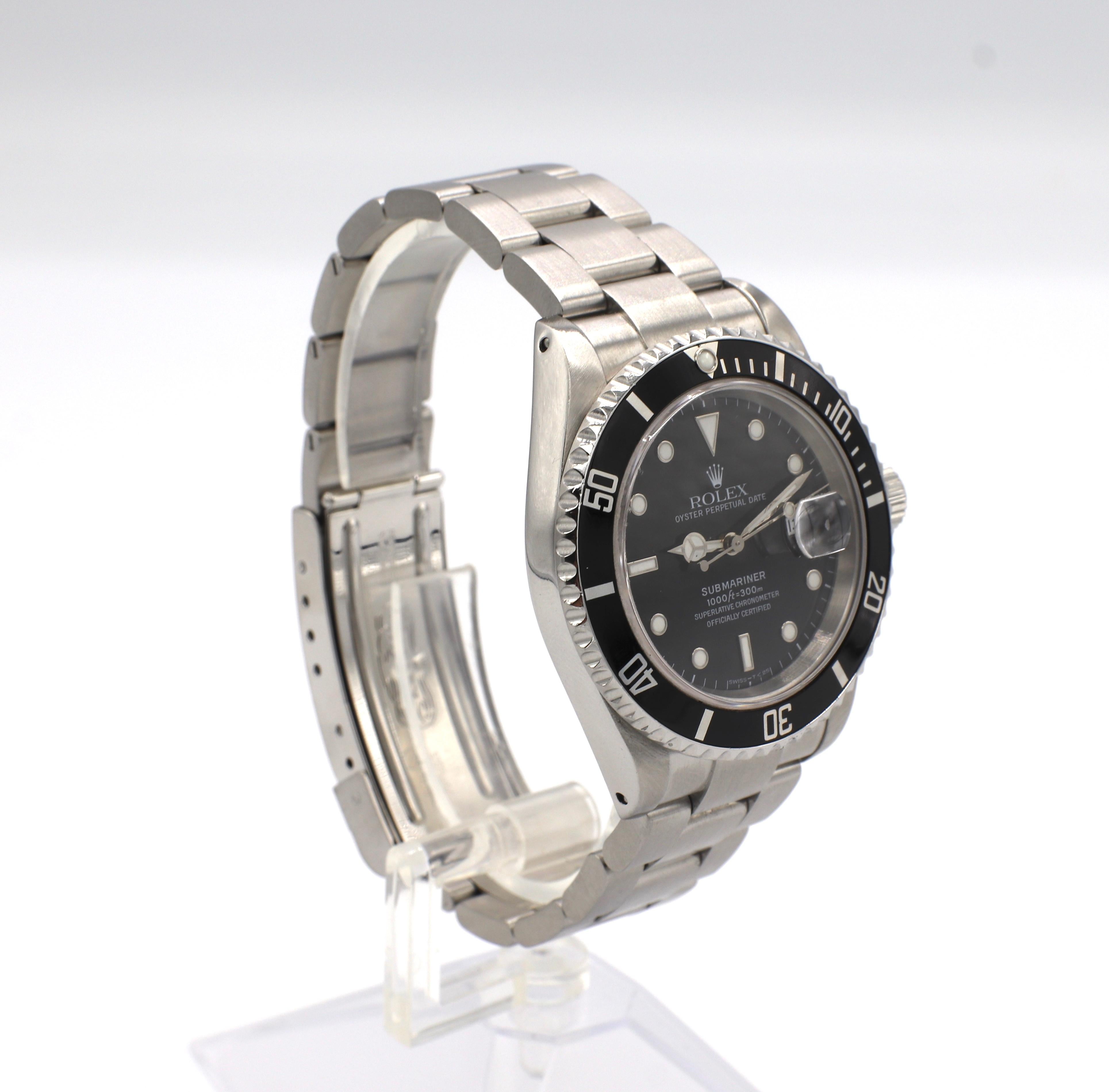Rolex Submariner Stainless Steel Reference 16610

Model/Reference: 16610
Serial: T990*** (circa 1996)
Metal: Stainless steel
Dial: Black
Case: 40mm
Movement: Automatic 
Condition: Very good, slight scratches to crystal and date magnifier.