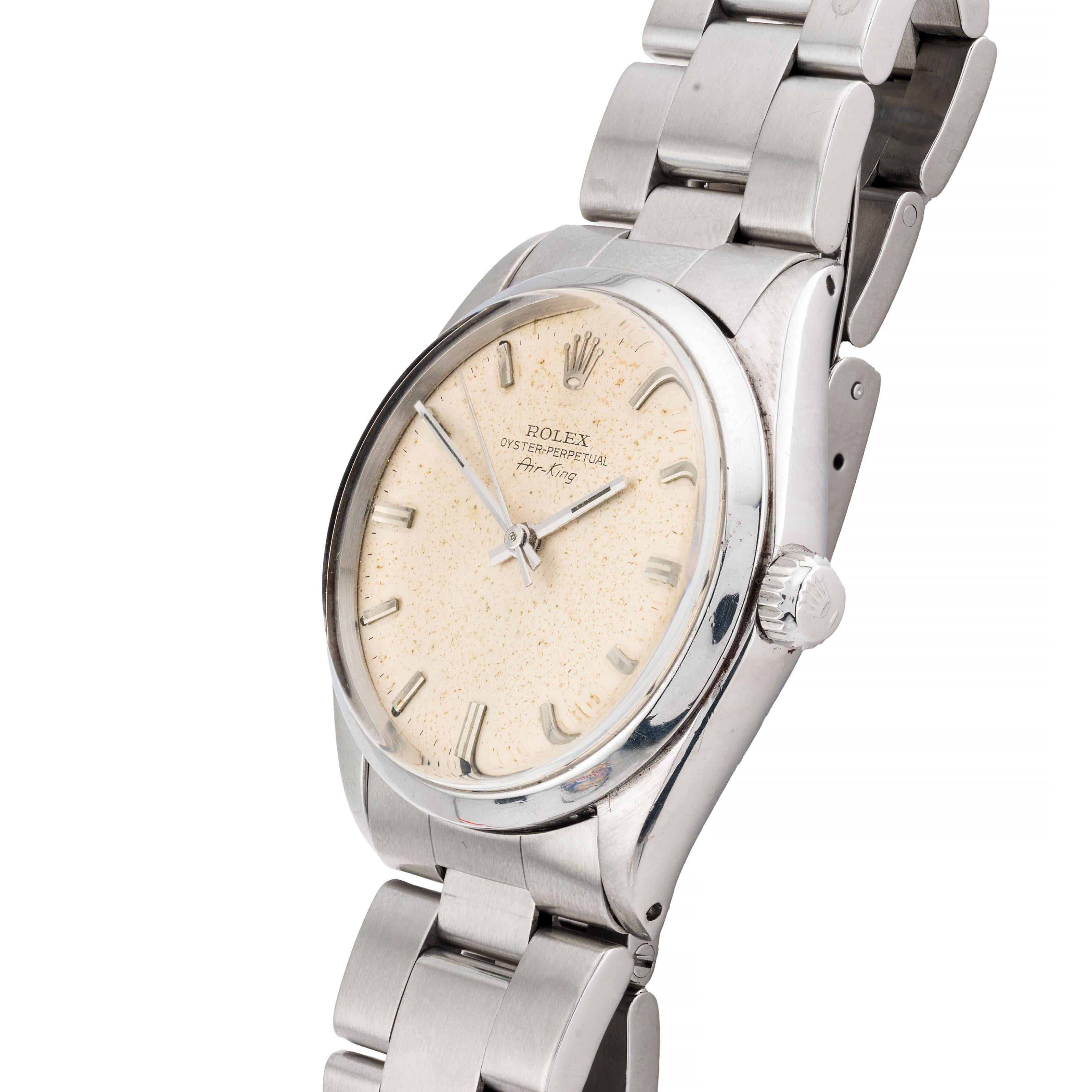 Aston Estate Jewelry Presents:

A vintage Rolex Oyster Perpetual Air-King wristwatch crafted in stainless steel.

The round watch features a richly patinaed speckled cream dial with sleek rectangular hour markers. The dial is marked with the Rolex