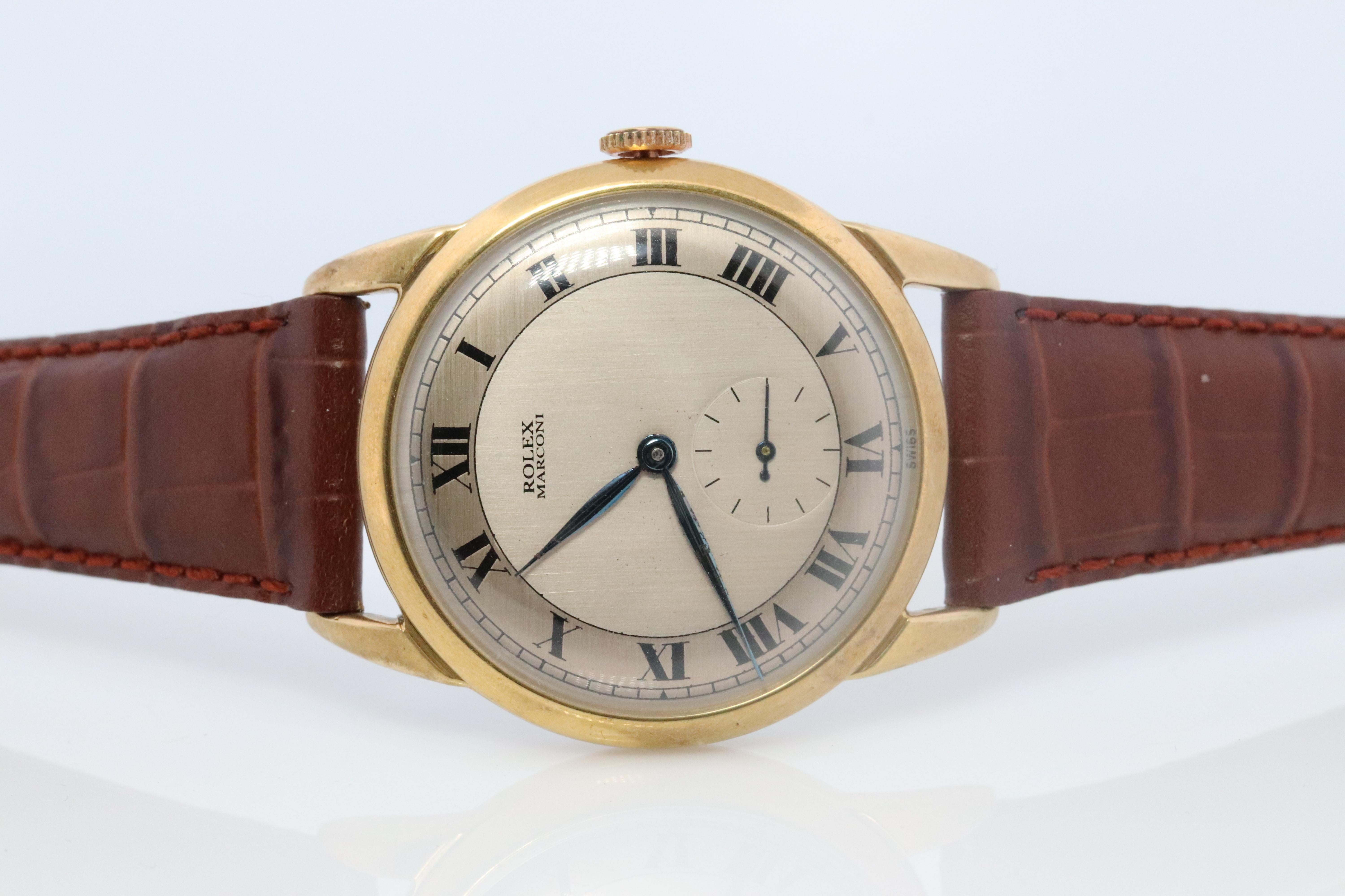 Vintage Rolex Marconi Mens Watch

Gold Plated Stainless Steel

Ref 6732

Windup Movement. Runs well.

Circa 1950s

Beautiful Watch.

New Genuine Gucci Leather band.

34mm round Case