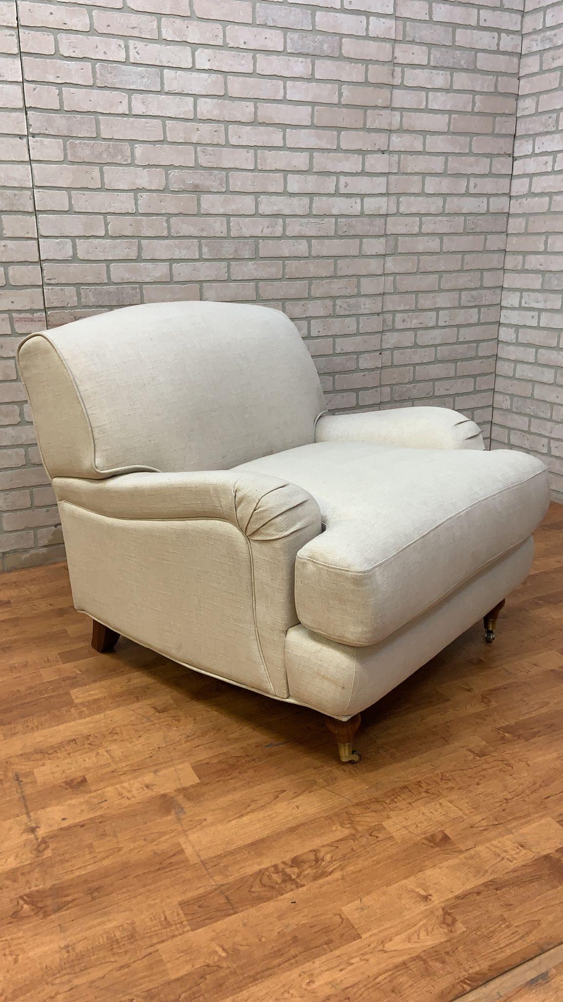 Vintage Rolled Arm Sydney Club Chair Upholstered in Cream Linen

Beautifully crafted vintage rolled arm Sydney club chair upholstered in cream linen. Front turned wood carved legs on antique brass casters. This Sydney club chair is versatile,