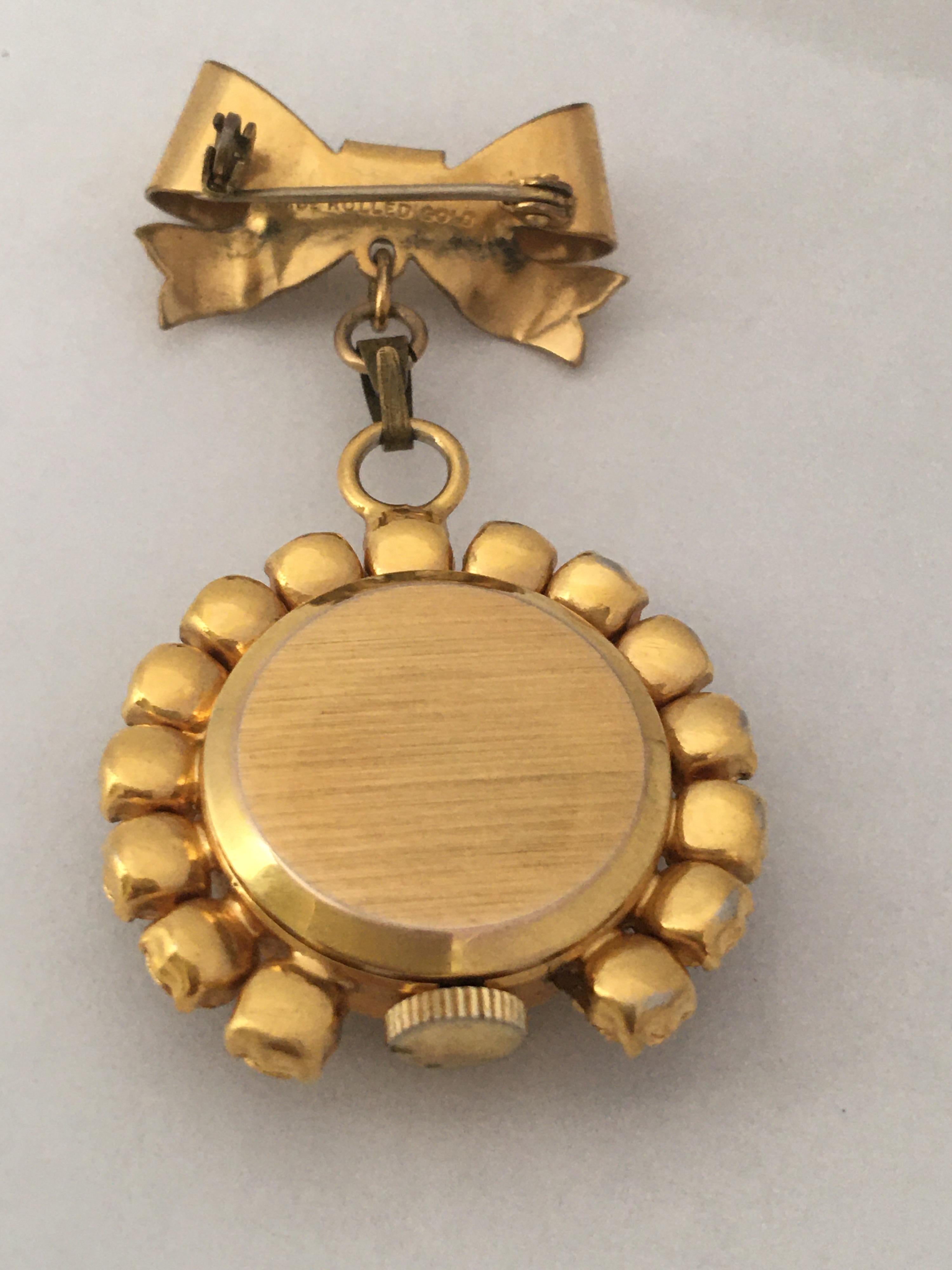 watch brooch