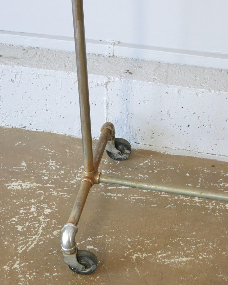 Vintage Rolling Garment Rack Clothes Rack For Sale at 1stDibs