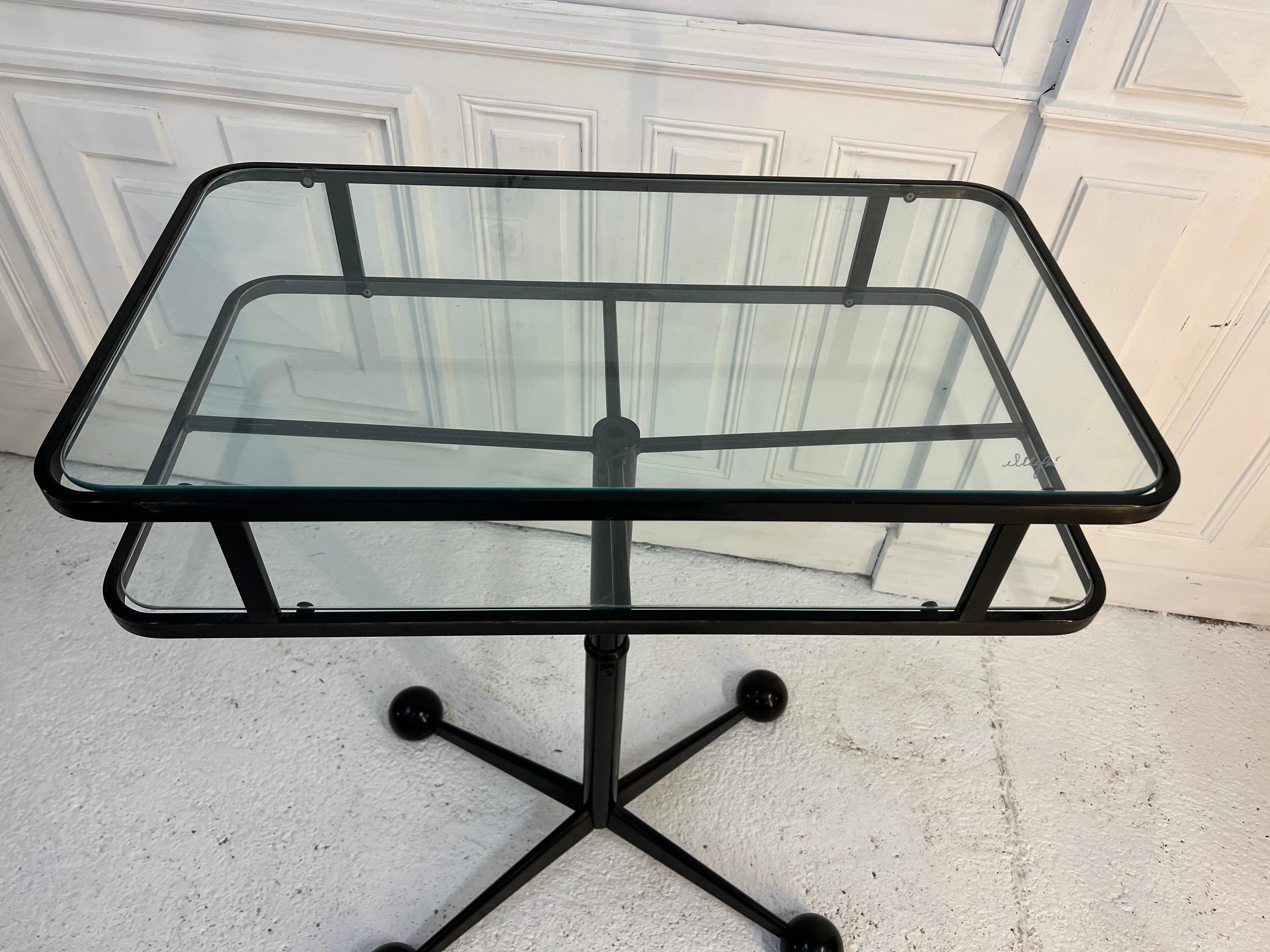 Vintage rolling side table by Allegri Arredementi, Italy
the double top is adjustable in height, minimum 55 cm and maximum 110 cm
its star base gives it this very 1950 1960 style.

