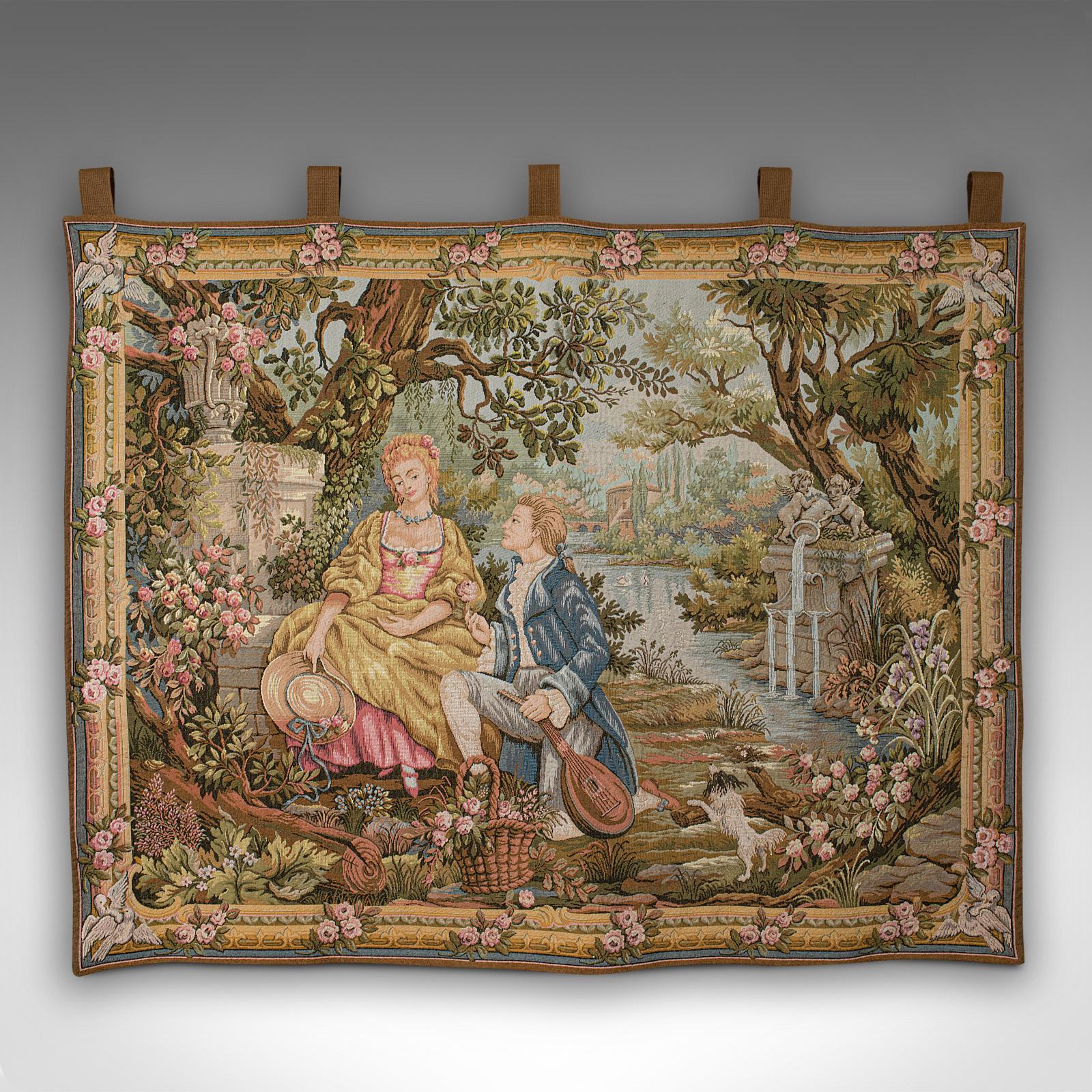 This is a vintage romance tapestry. A French, needlepoint decorative panel by Marc Waymel, dated to rear 1987.

Classically appealing continental scene with great colour
Displays a desirable aged patina and in good order
Quality needlepoint with