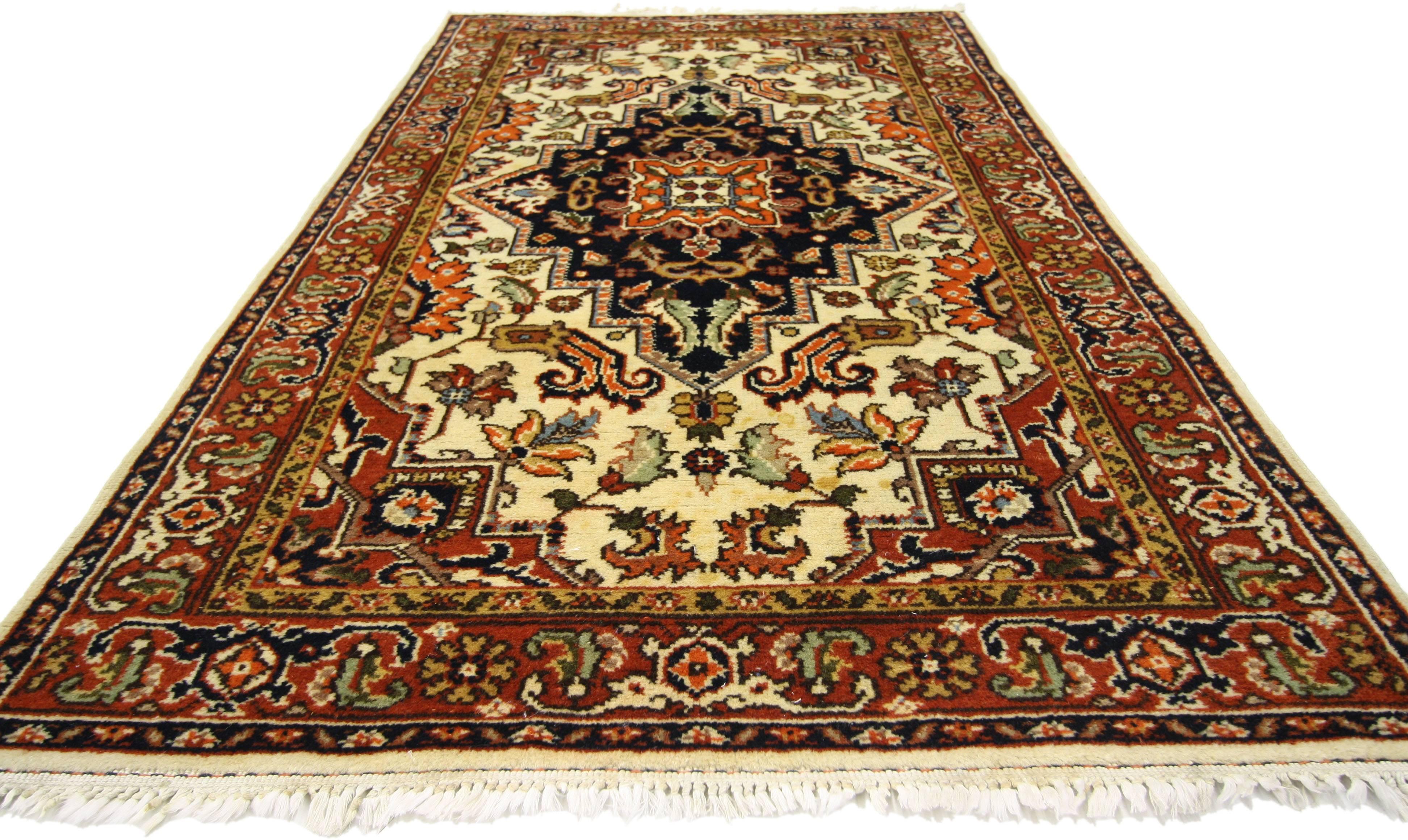 77148, vintage Romanian accent rug with rustic style. This hand knotted wool vintage Romanian rug features a large stepped amulet lozenge medallion with a deep, dark backdrop. The stepped medallion sits against a creamy-beige color field replete