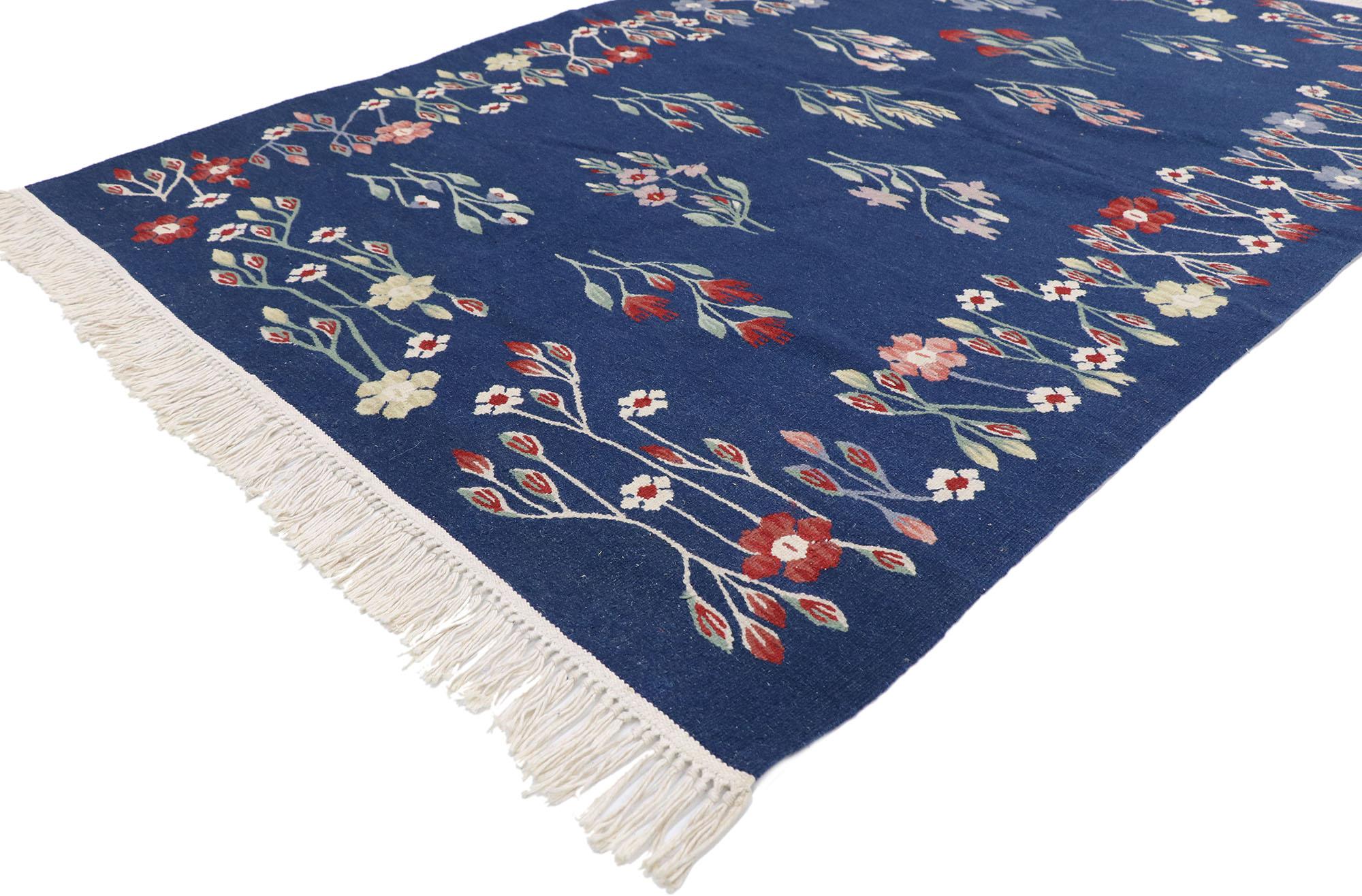 78031 Vintage Romanian Bessarabian Floral Kilim rug with Folk Art Cottage 04'02 x 06'00. Delicately feminine and beautifully traditional, this hand-woven wool vintage Romanian floral kilim rug is poised to impress. The navy blue abrashed field