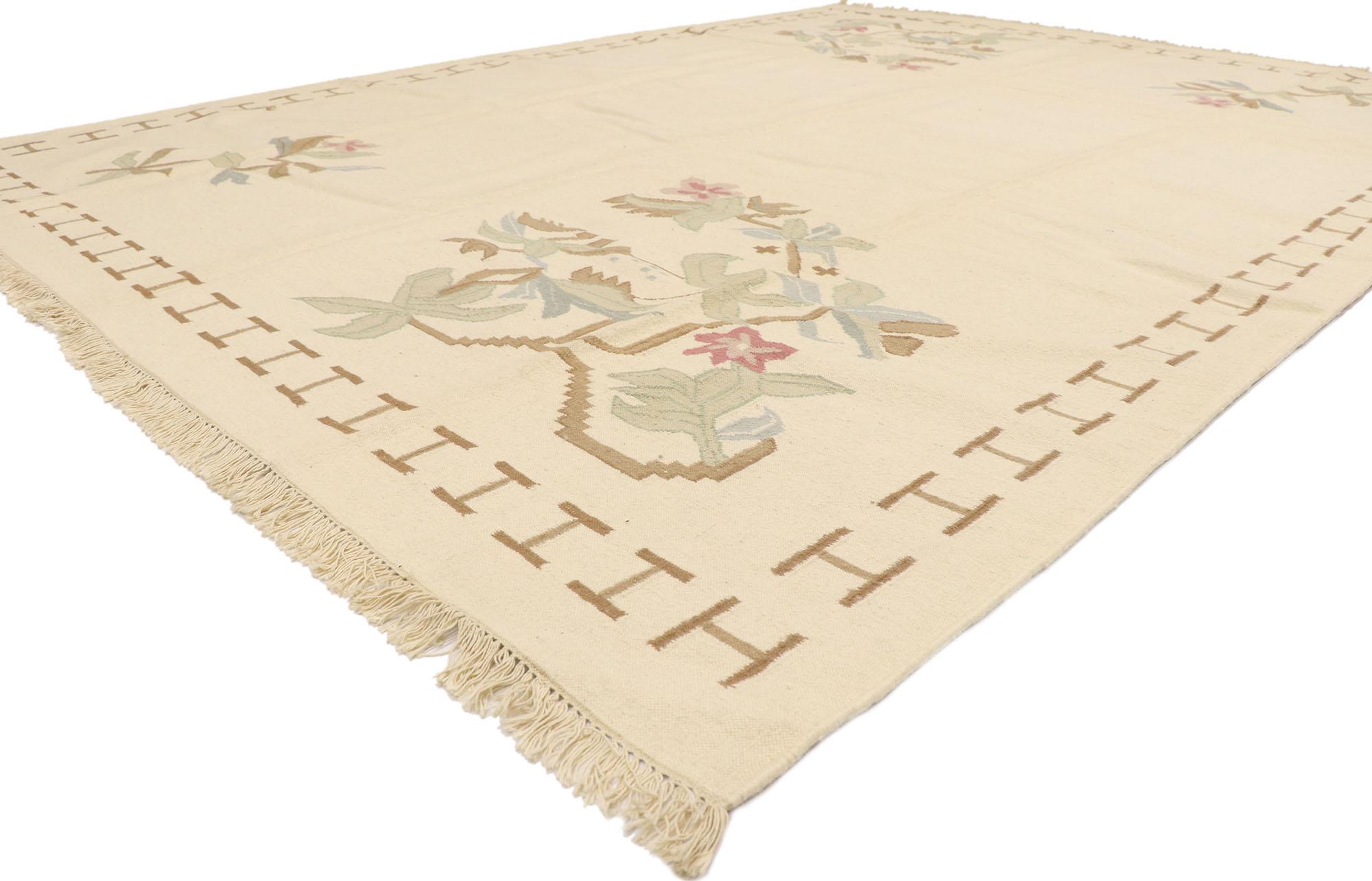 78000 Vintage Romanian Floral Kilim rug 08'07 x 11'06. With its effortless beauty and timeless style, this hand-woven wool vintage Romanian floral kilim rug is a captivating vision of woven beauty. It is enclosed with a thin repeating I-motif
