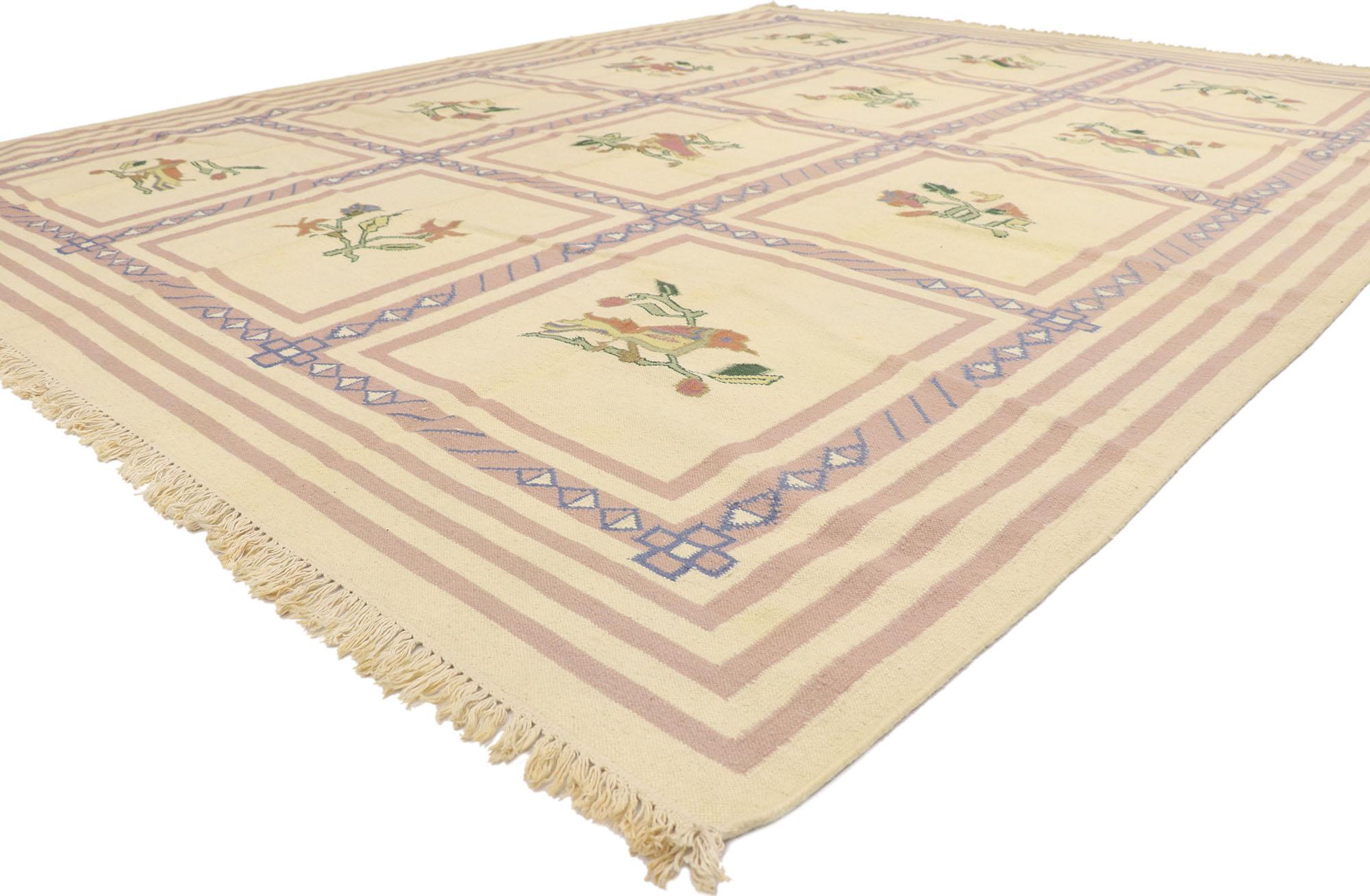 77938 Vintage Romanian Floral Kilim rug 09'03 x 11'08. With its effortless beauty and timeless style, this hand-woven wool vintage Romanian floral kilim rug is a captivating vision of woven beauty. The abrashed beige field beautifully displays a