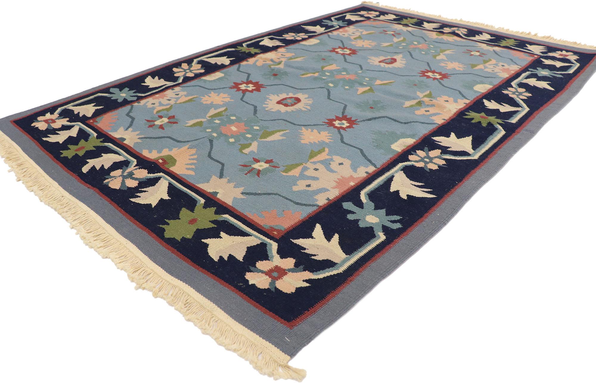 77991 Vintage Romanian Floral Kilim Rug with Folk Art Cottage Style 03'11 x 05'10. Delicately feminine and beautifully traditional, this hand-woven wool vintage Romanian floral kilim rug is poised to impress. The sky blue abrashed field features an
