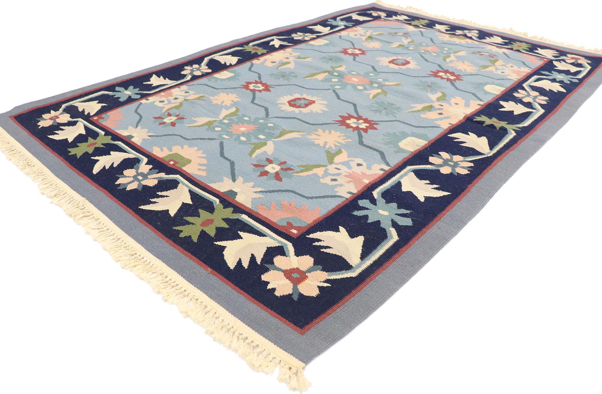 77954 Vintage Romanian Floral Kilim rug with Folk Art Cottage Style 03'11 x 05'11. Delicately feminine and beautifully traditional, this hand-woven wool vintage Romanian floral kilim rug is poised to impress. The sky blue abrashed field features an