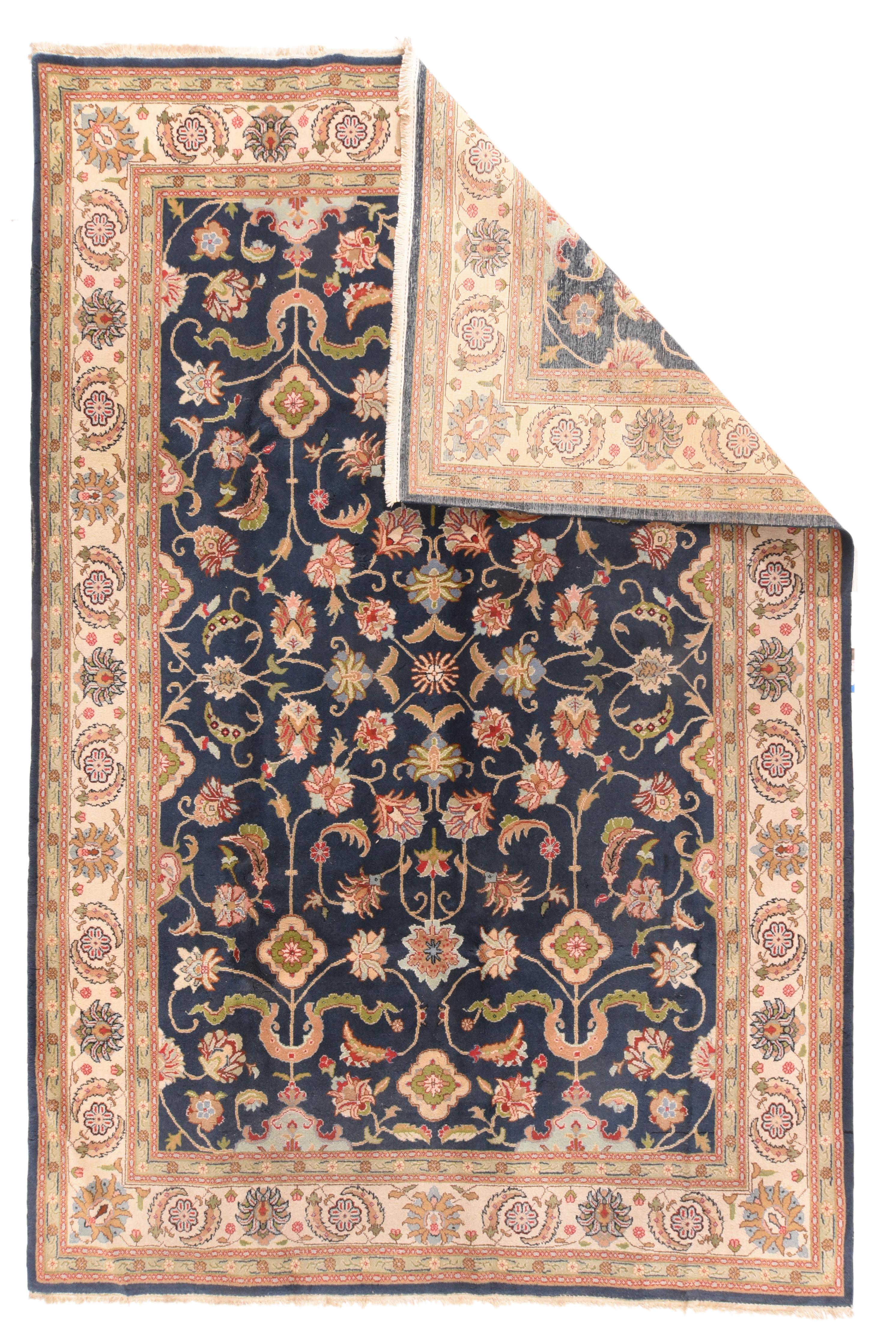 Vintage Romanian rug 7'8'' x 10'7''. The navy field shows four lively cloud bands accenting a palmette, sickle leaf and stem allover pattern centred around an open diamonds and radiating rosette. Cream sand border with sickle leaf, rosette and petal