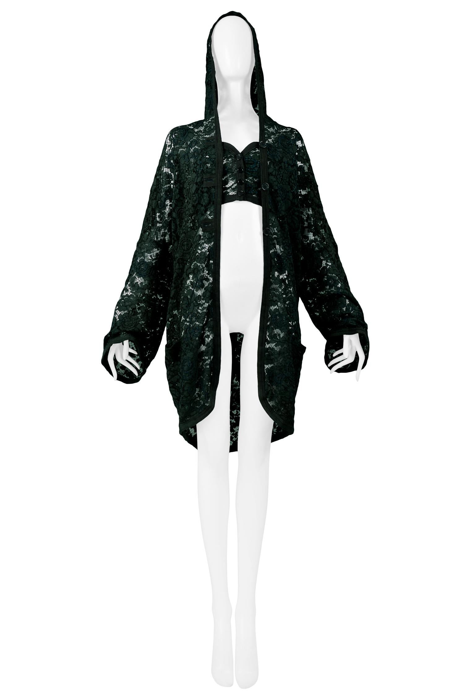 Resurrection Vintage is excited to offer a vintage Romeo Gigli green floral lace hooded jacket. The jacket features a lace hood, oversized body, side pockets, matching trim, and center button closure. Pictured with a matching green lace cropped