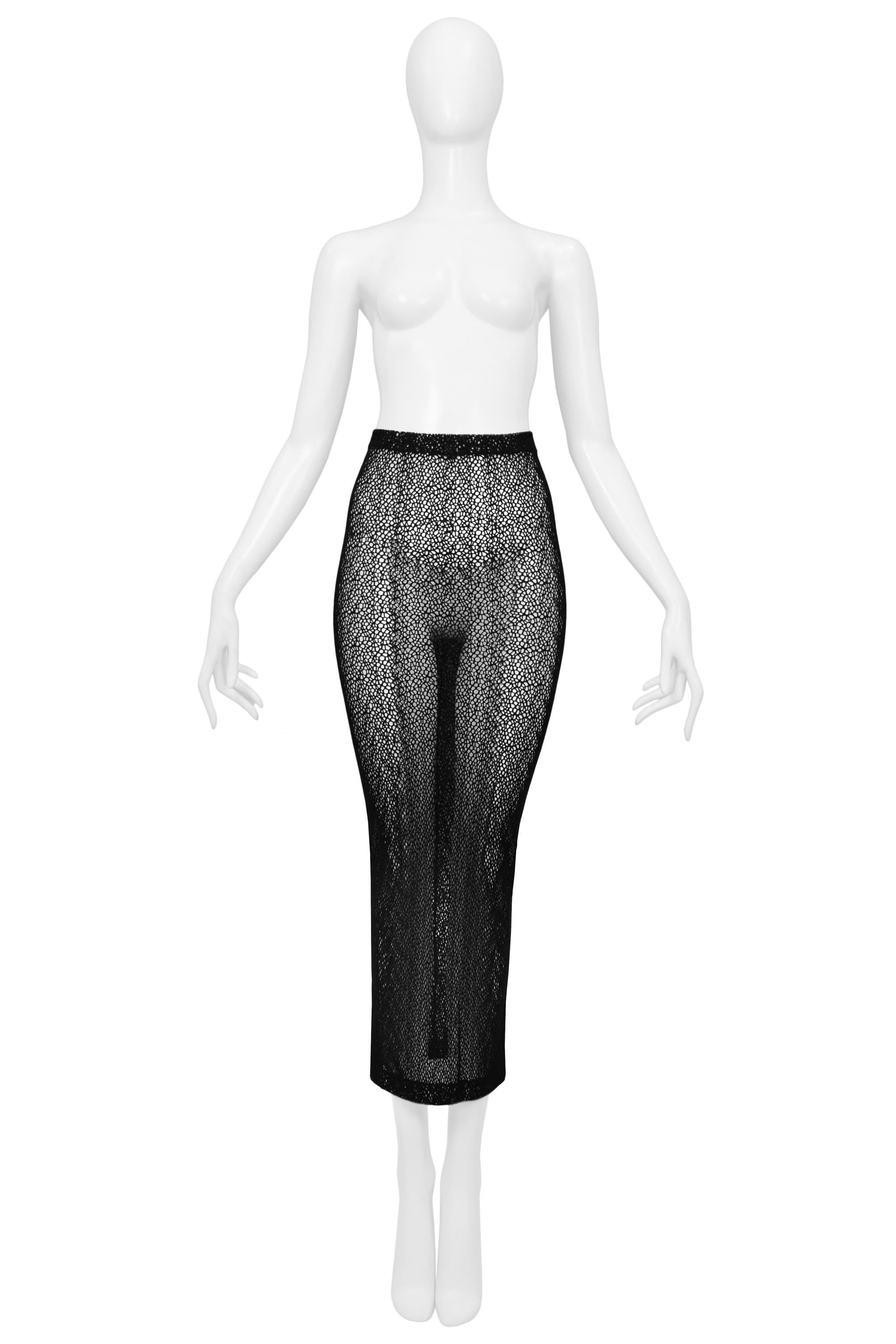 Resurrection Vintage is excited to present a vintage Romeo Gigli black midi skirt featuring mesh net fabric and elastic waist.

Romeo Gigli
Unmarked Small
Poly Stretch
Excellent Vintage Condition 
Authenticity Guaranteed 