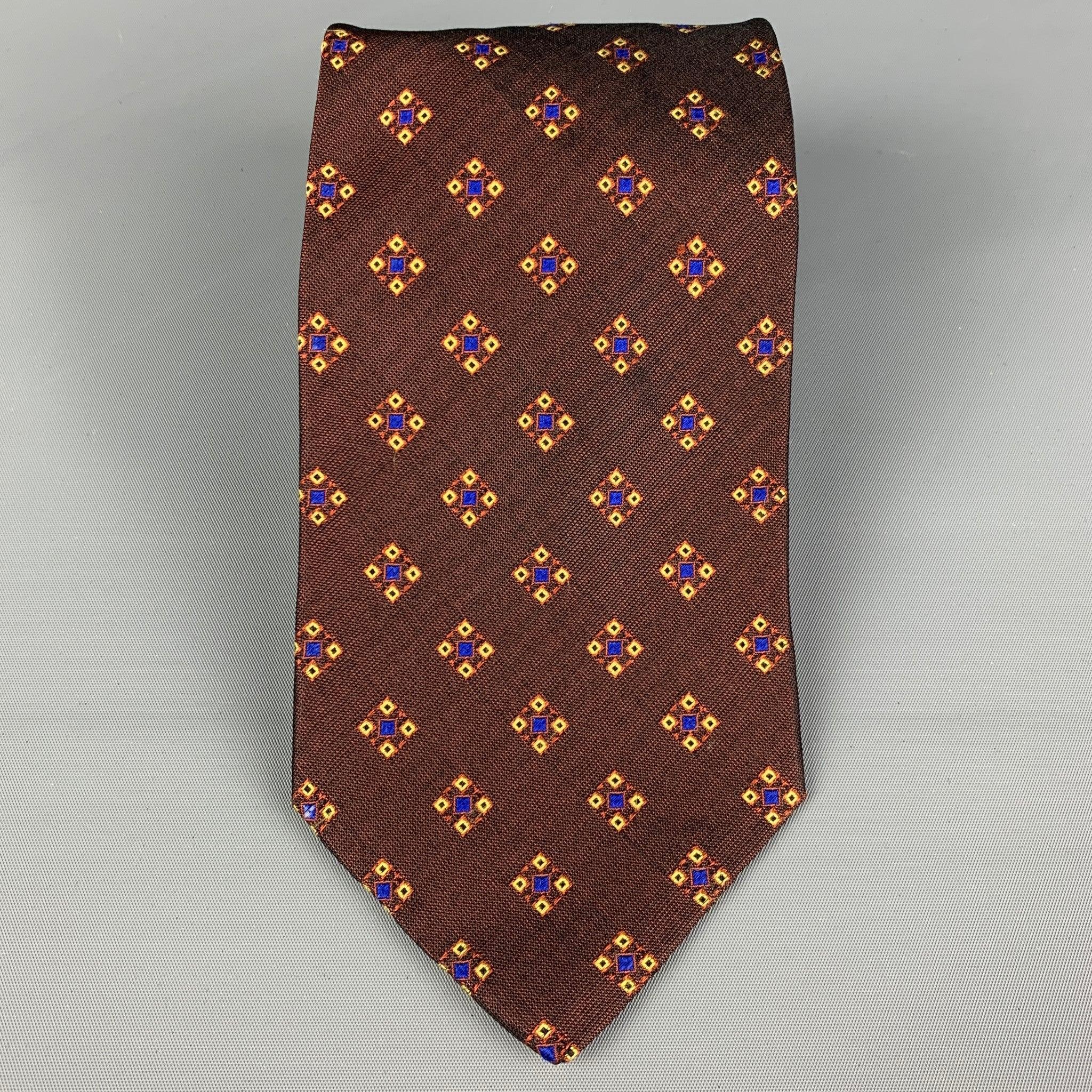 Vintage ROMEO GIGLI
 necktie comes in a burgundy & yellow silk with a all over abstract print. Made in Italy. Very Good Pre-Owned Condition.Width: 3.75 inches 
  
  
  
 Sui Generis Reference: 112523
 Category: Tie
 More Details
  
 Brand: ROMEO