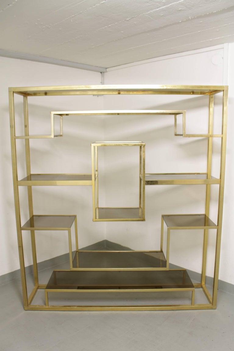 Vintage brass and glass shelving by Romeo Rega, Italy ca. 1970s
Good condition.
Dismountable for shipping. With instructions for rebuild.
Clear glass.
Measures: W 162 x H 180 x D 38 cm.