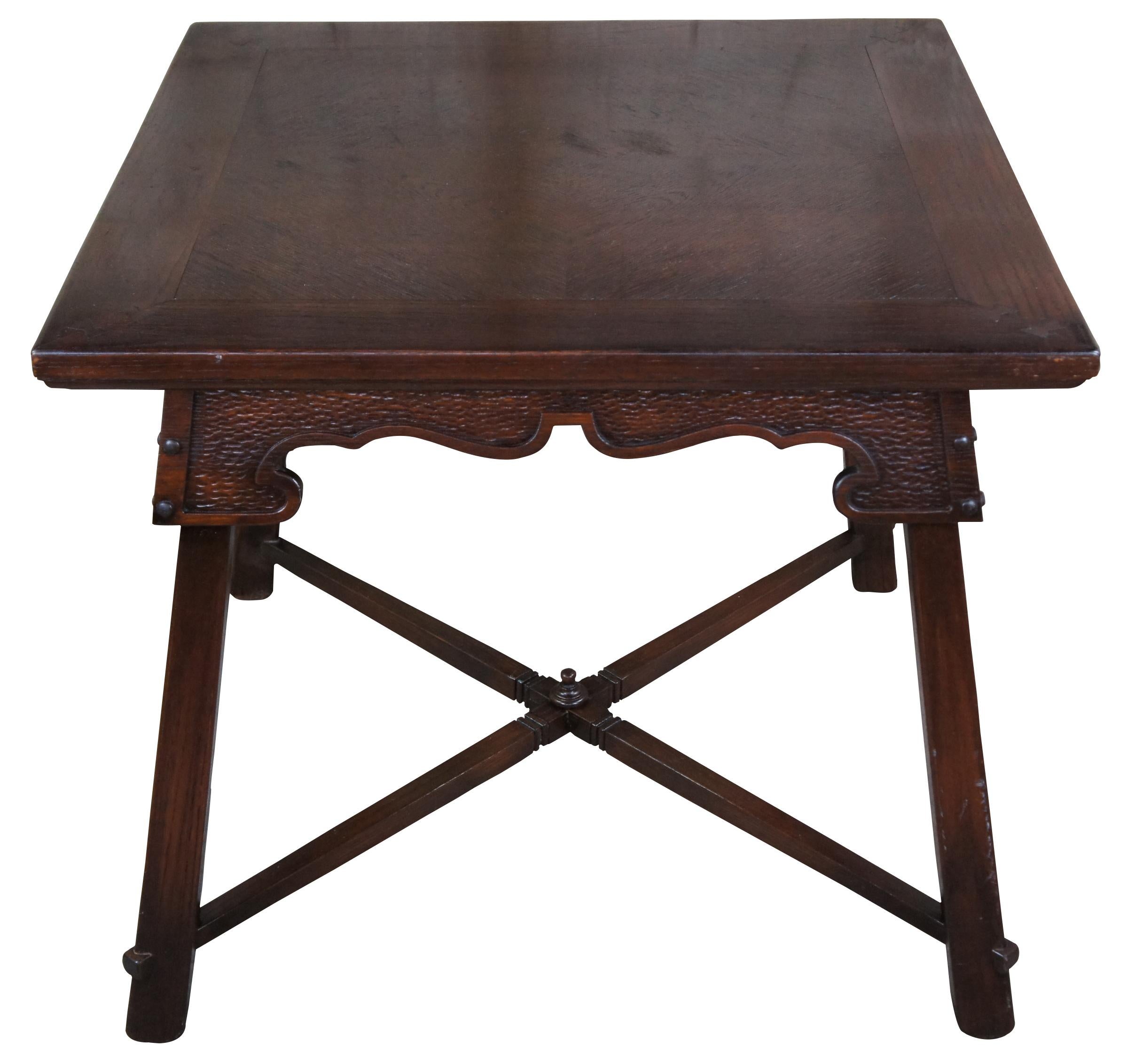 Vintage Romweber Viking oak square breakfast, dining or game table featuring square form with dovetailed accents, carved apron and X stretcher with finial. Measures: 34