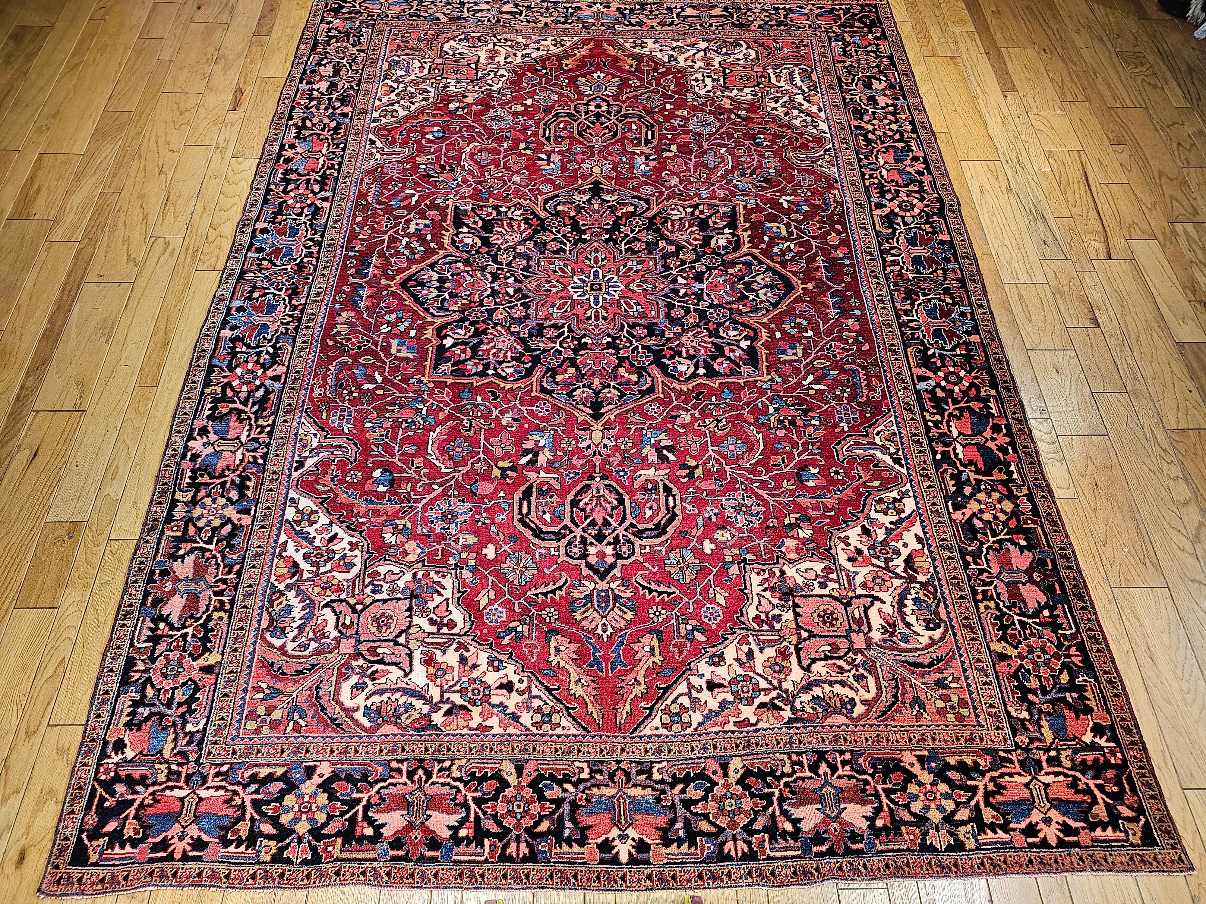 A room-size Heriz rug with Serapi colors from the Azerbaijan region of Northwest Persia. The Heriz rugs have ageless beauty and because of the use of natural dyes, they develop more beautiful color hues (abrash) over many generations of use. This
