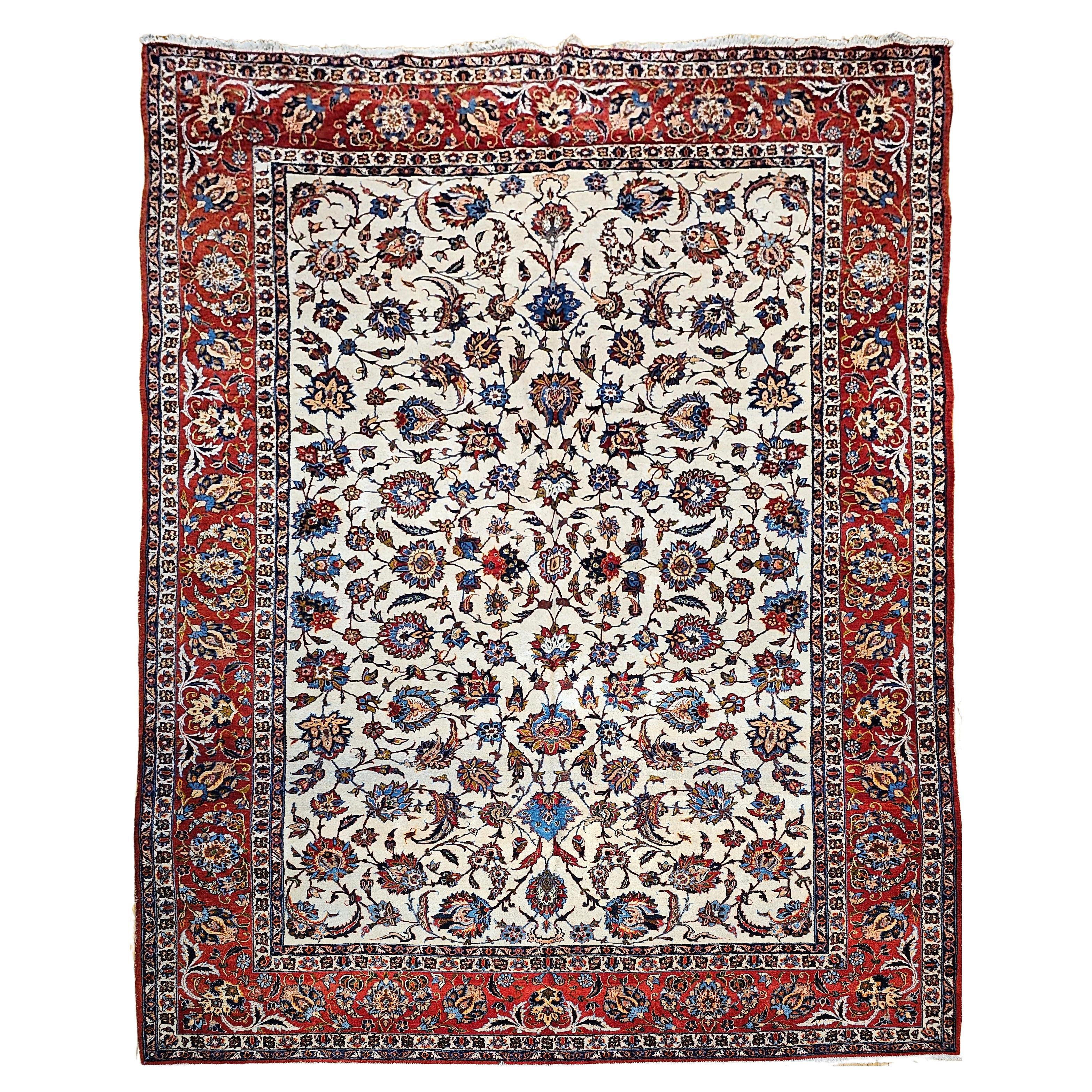 Taille de la pièce vintage Persian Isfahan en motif floral sur toute sa surface en ivoire, rouge et bleu