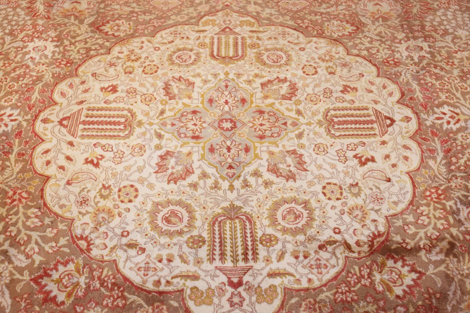 Finely woven vintage room sized Tabriz carpet, country of origin: Persia, date circa mid-20th century. Size: 9 ft 9 in x 13 ft (2.97 m x 3.96 m). Traditional floral elements blend well with passionate colors and flowing tones in this classically