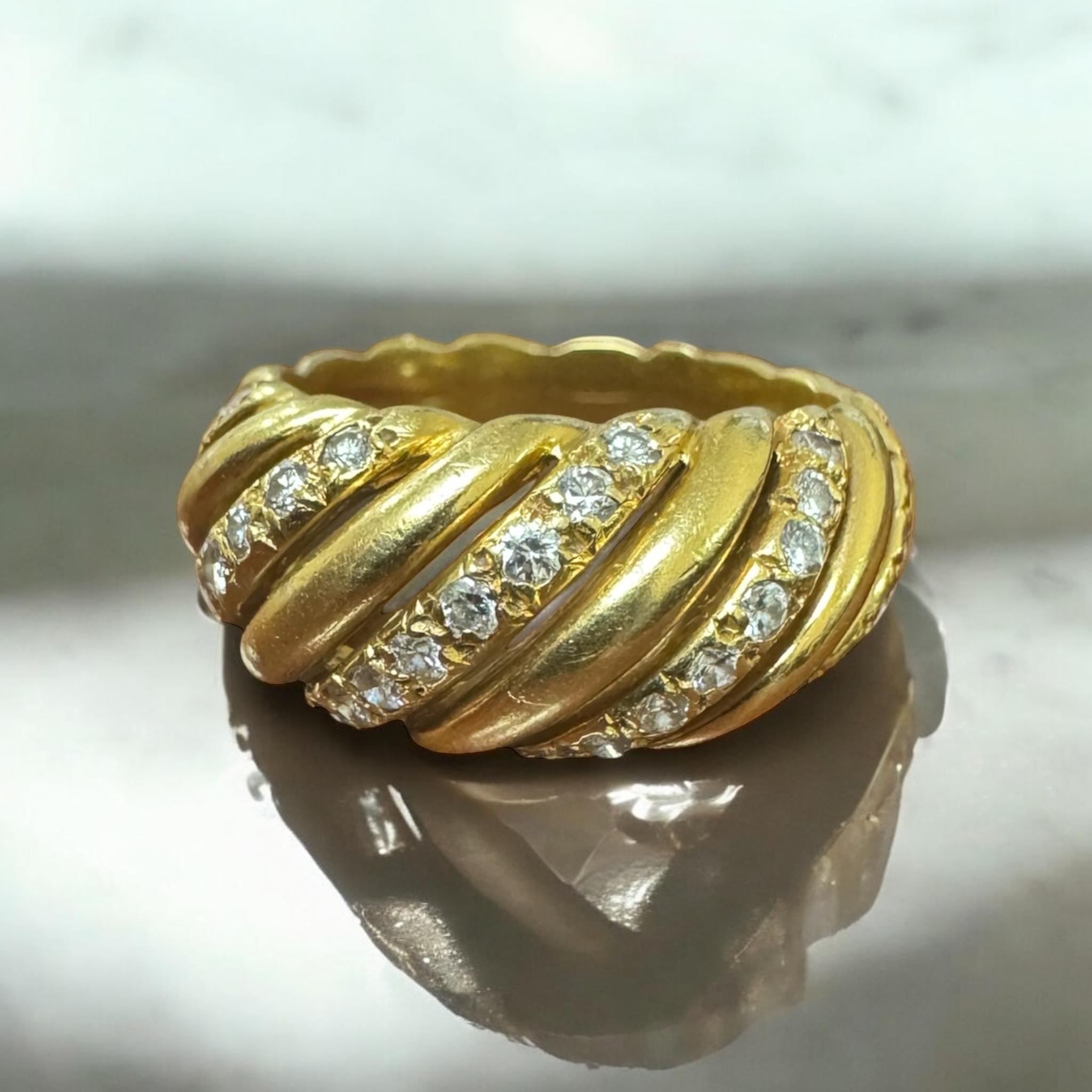 We are loving this simple yet classic beauty!!

Ring Details
Material: 18K Yellow Gold
Head Width: 9.5mm
Head Height: 4.6mm
Shank Width: 4mm
Weight: 8.3 Grams
Finger Size: 6 1/2
Sizable Upon Request

Accented by the following gemstones
37 - 1.8mm
