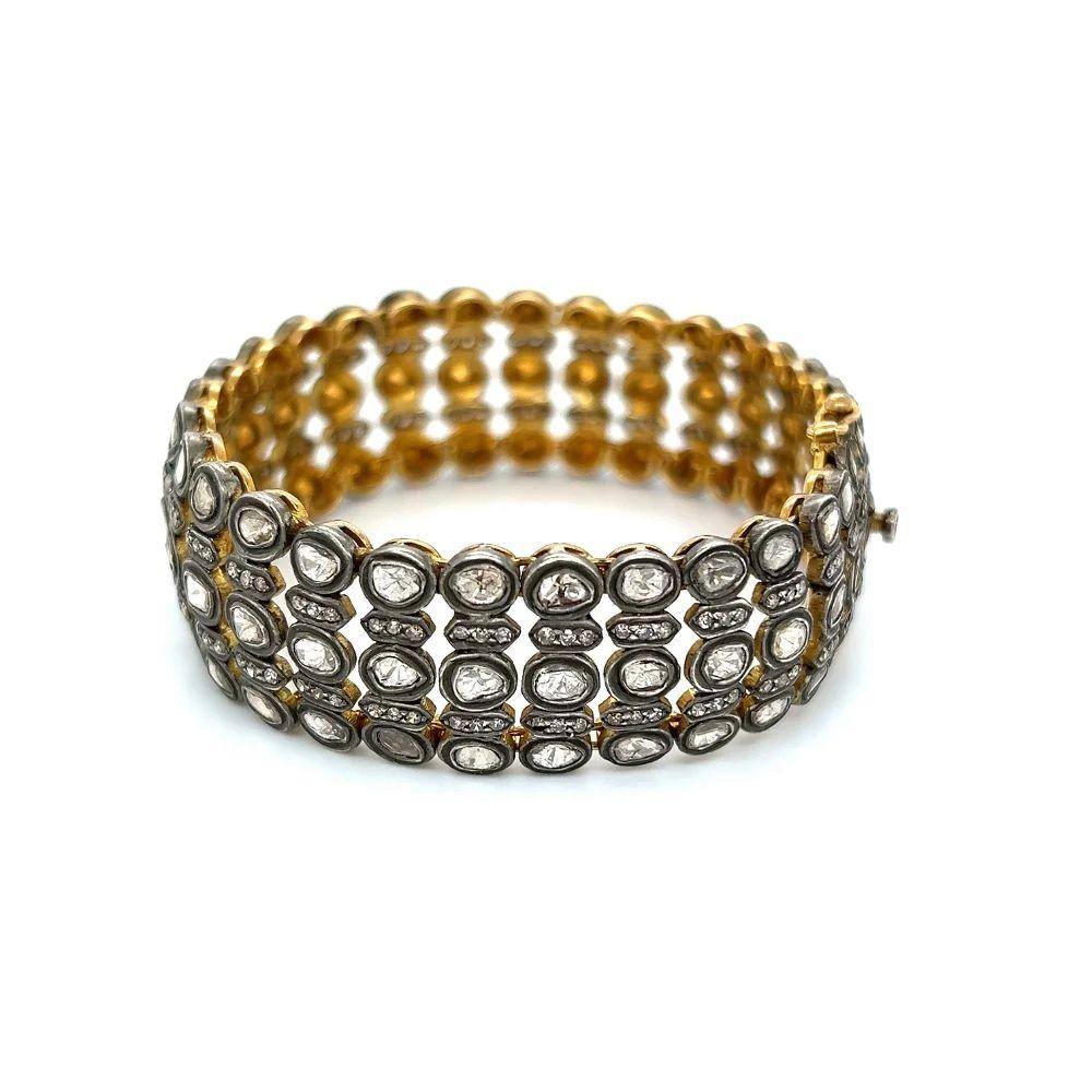 Simply Beautiful! Finely detailed Vintage 5 Row Diamond Gold and Sterling Silver Bracelet. Securely Hand set with 8.00tcw Rose Cut and Round Diamonds. Measuring approx. 6.75”. Intricate design Hand crafted in 18K Yellow Gold and Silver. More