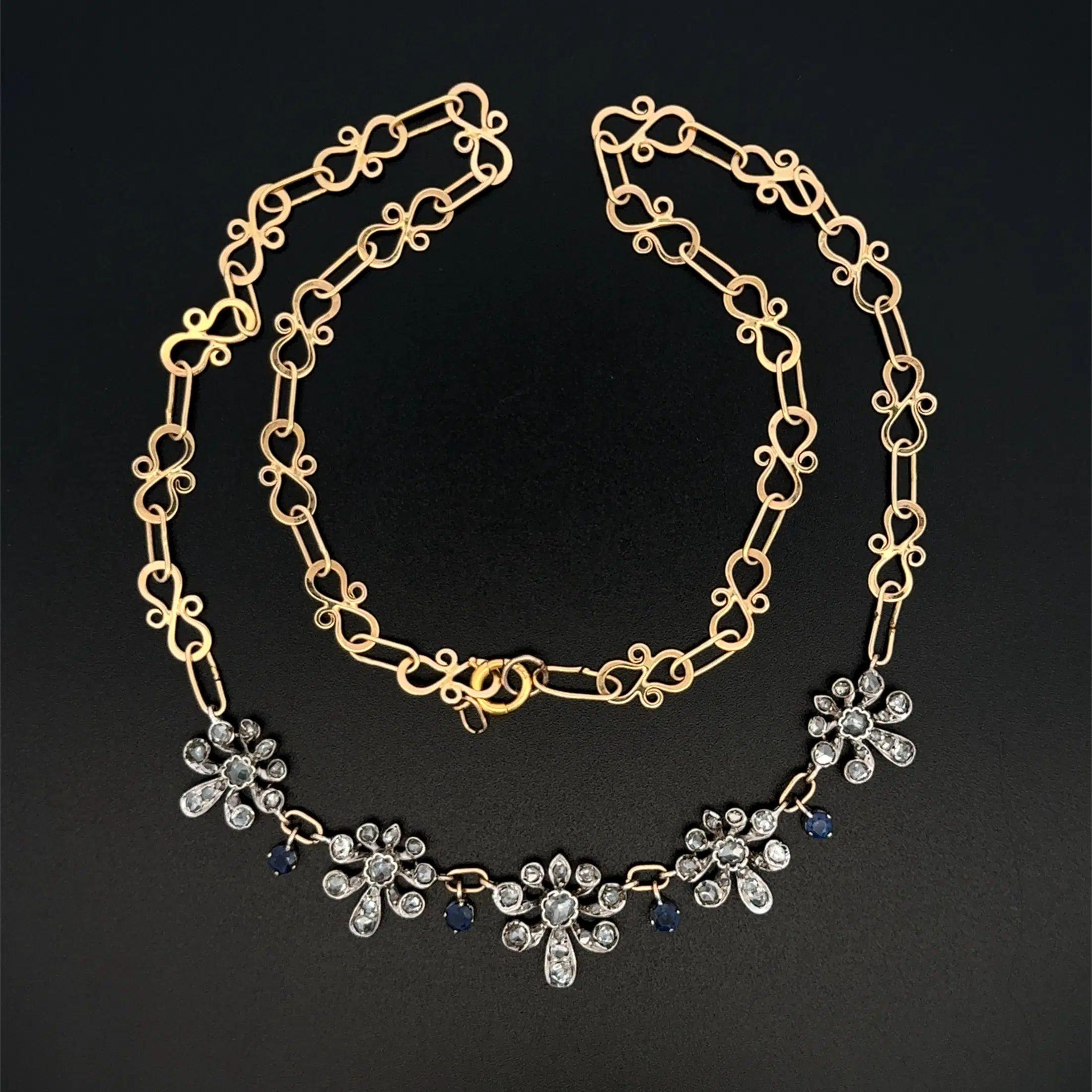 Tout simplement magnifique ! Vintage Diamond and Sapphire Platinum on 14K Link Chain Statement Necklace (Collier de diamants et de saphirs en platine sur chaîne à maillons en or 14K). Le bracelet est composé de 5 stations de fleurs en diamants