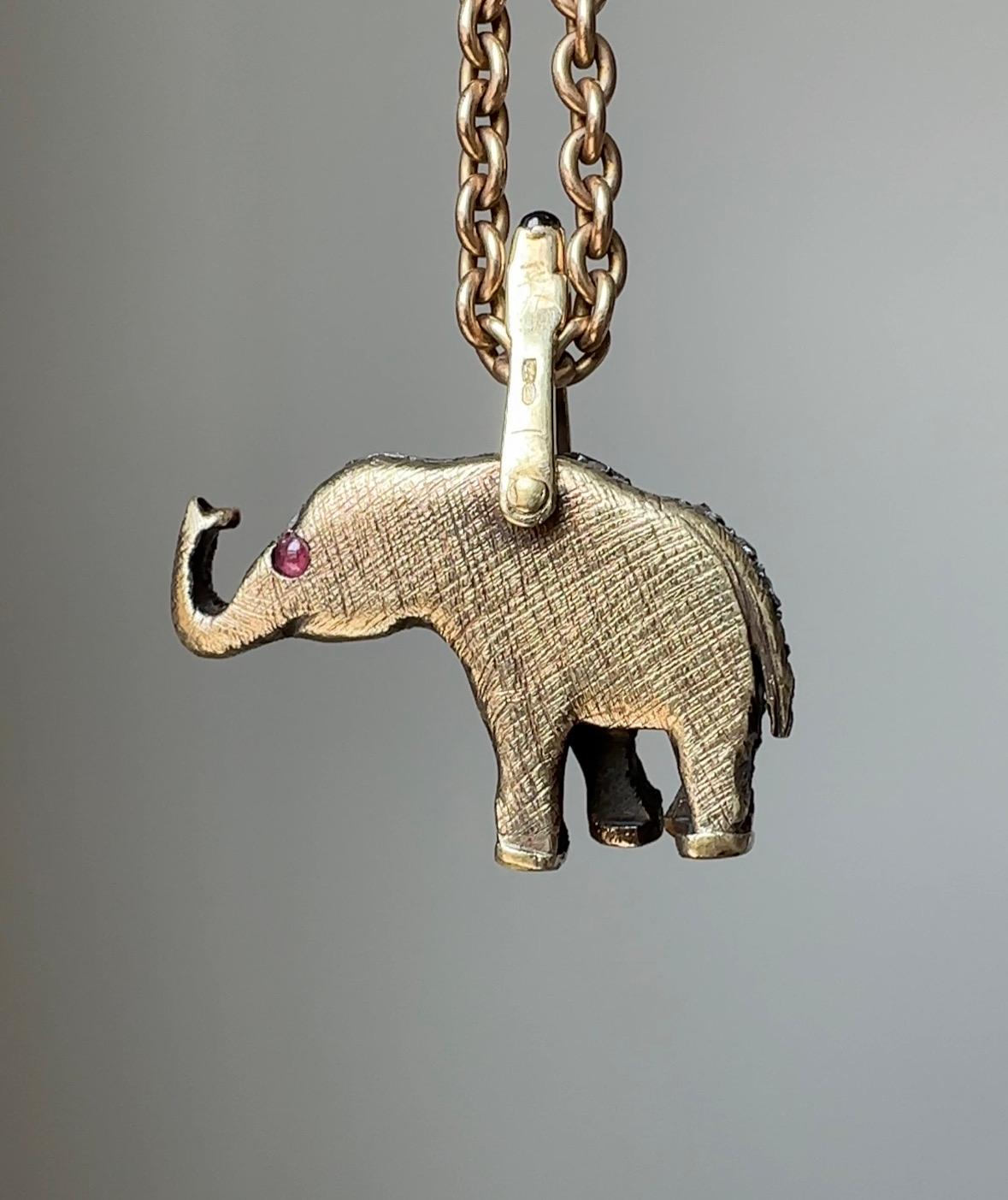 This whimsical rose-cut diamond elephant is both a symbol of strength and good luck, making this a wonderful talisman to add to your jewelry wardrobe. Artfully crafted in 14k gold and sterling silver, this handsome fella is complete with cabochon