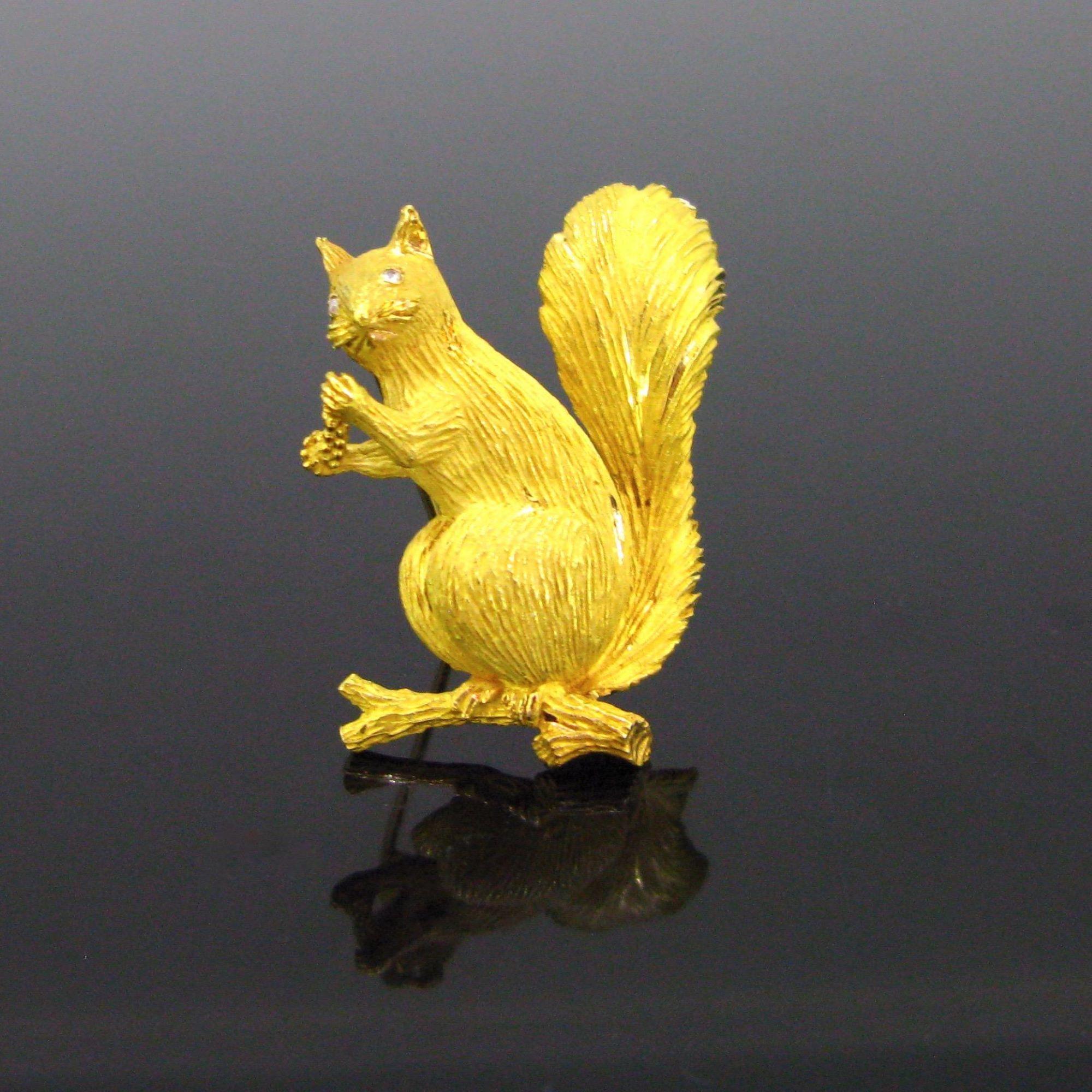 Weight:	11.51gr


Metal:		18kt yellow gold 


Stones:	2 rose cut diamonds


Condition:	Very Good


Comments:	This adorable squirrel on a branch is fully made in 18kt solid gold (tested). His eyes are adorned with rose cut diamonds. He is carrying a