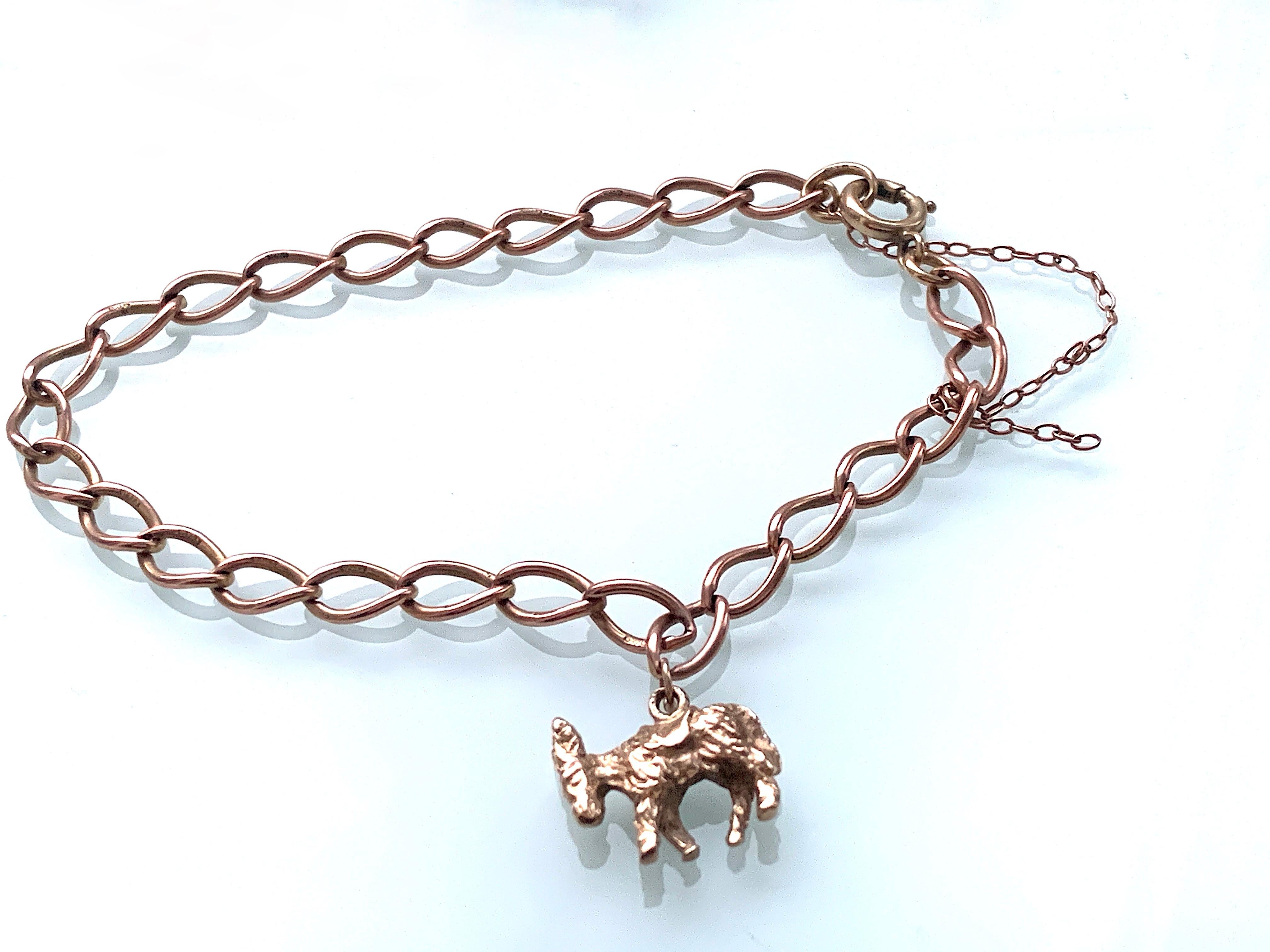 Vintage Rose Gold Bracelet
- each link is stamped 9 375-
with end link stamped W J S - dated 1963 
The bracelet weighs 7.14 grammes
Length 7.87 Inches

The Charm, the end clasp and the end jump ring all yellow gold.
all are soldered soldered to the