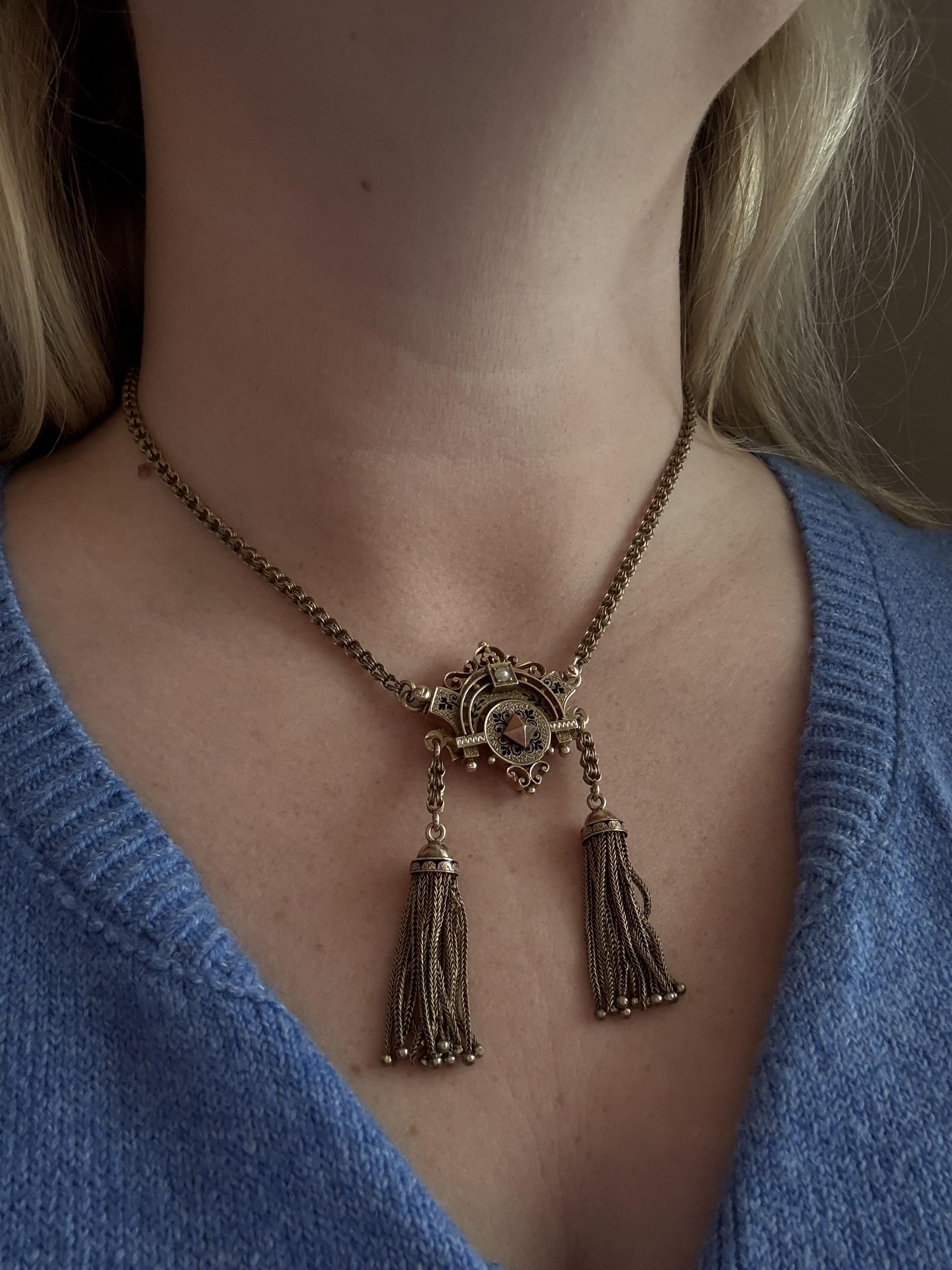We always love a vintage tassel necklace!!

Necklace Details
Material: 10K Rise Gold
Era: Victorian 1850 - 1890
Weight: 25.5 Grams
Engraved: M Love H
Drop Length: 2 1/2 Inches
Necklace Length: 16 3/4 Inches

Item: 768TMV8-APR