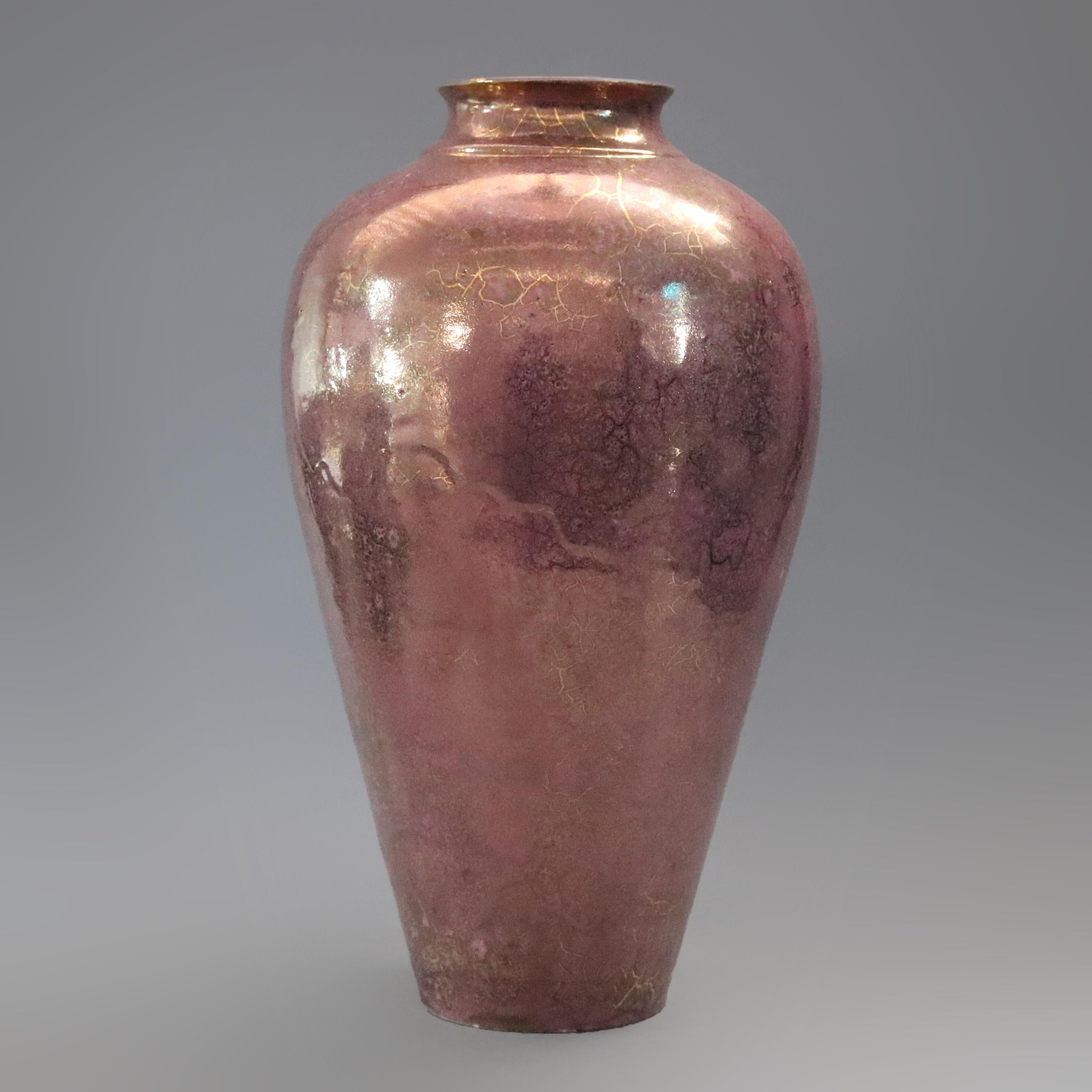 A vintage rose luster hand thrown art pottery floor vase offers urn form with metalic finish, circa 1960.

Measures - 23.25