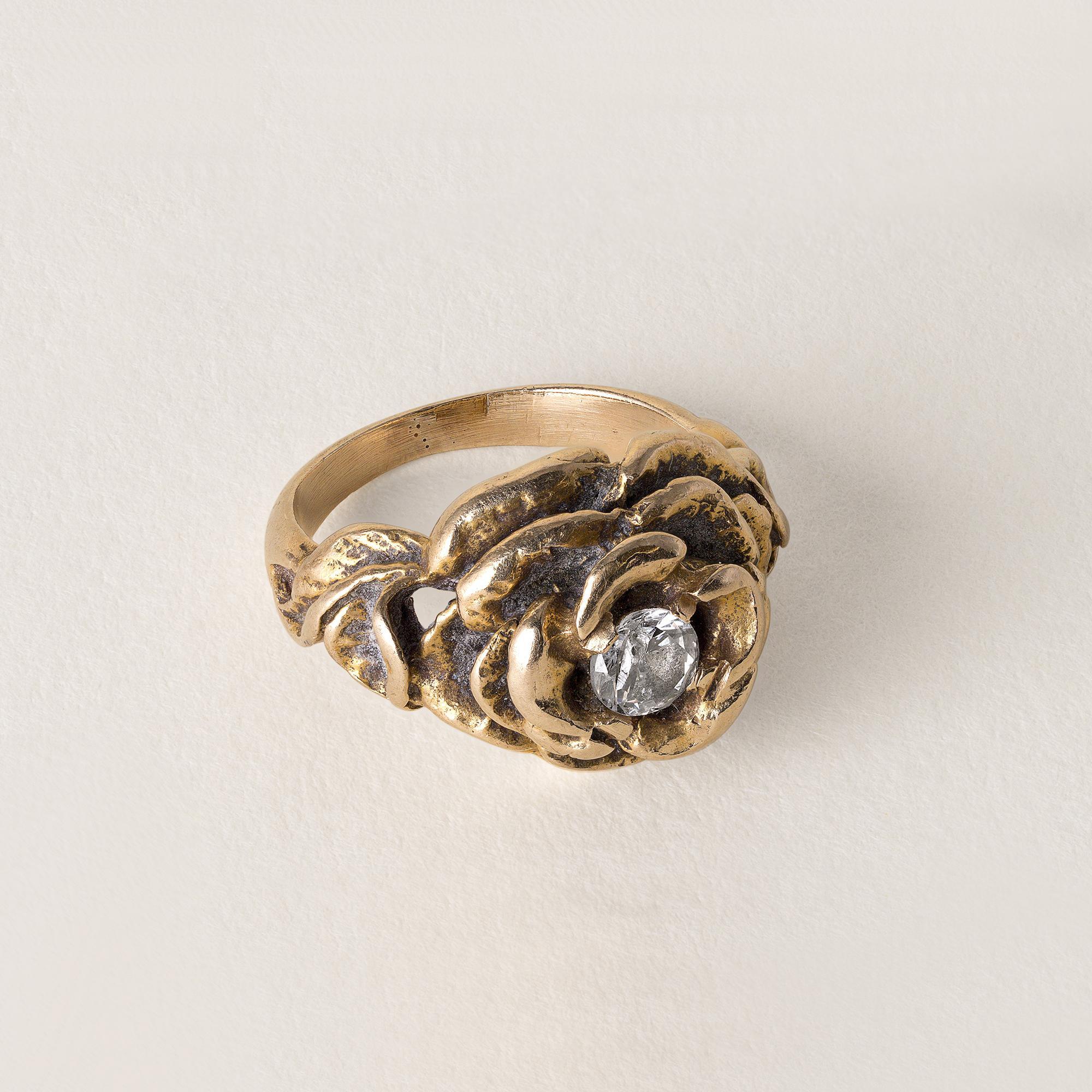 Circa 1970s
0.20 carat diamond set in the center of a rose in full bloom.
F-G I1
5.2 grams
14K gold
Ring size 2.5
Offering complimentary sizing
