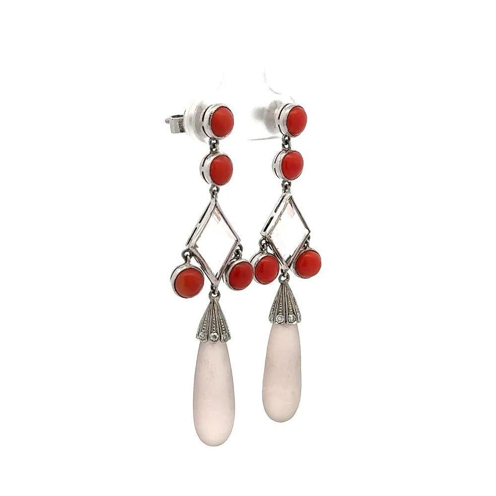 Simply Beautiful! Stylish and finely detailed Vintage Rose Quartz and Deep Red Coral Platinum Drop Earrings. Each earring featuring a Hand set Rose Quartz Drop, weighing approx. 18.70tcw for both. Suspended from Hand set Round Red Coral Gemstones,